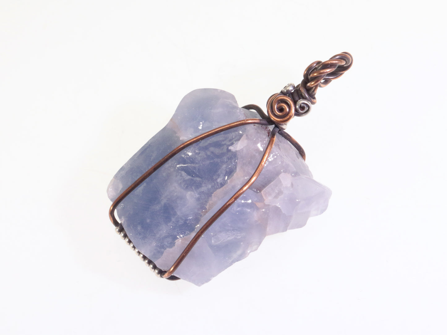 Natural blue calcite gemstone pendant wrapped in antiqued copper and sterling silver