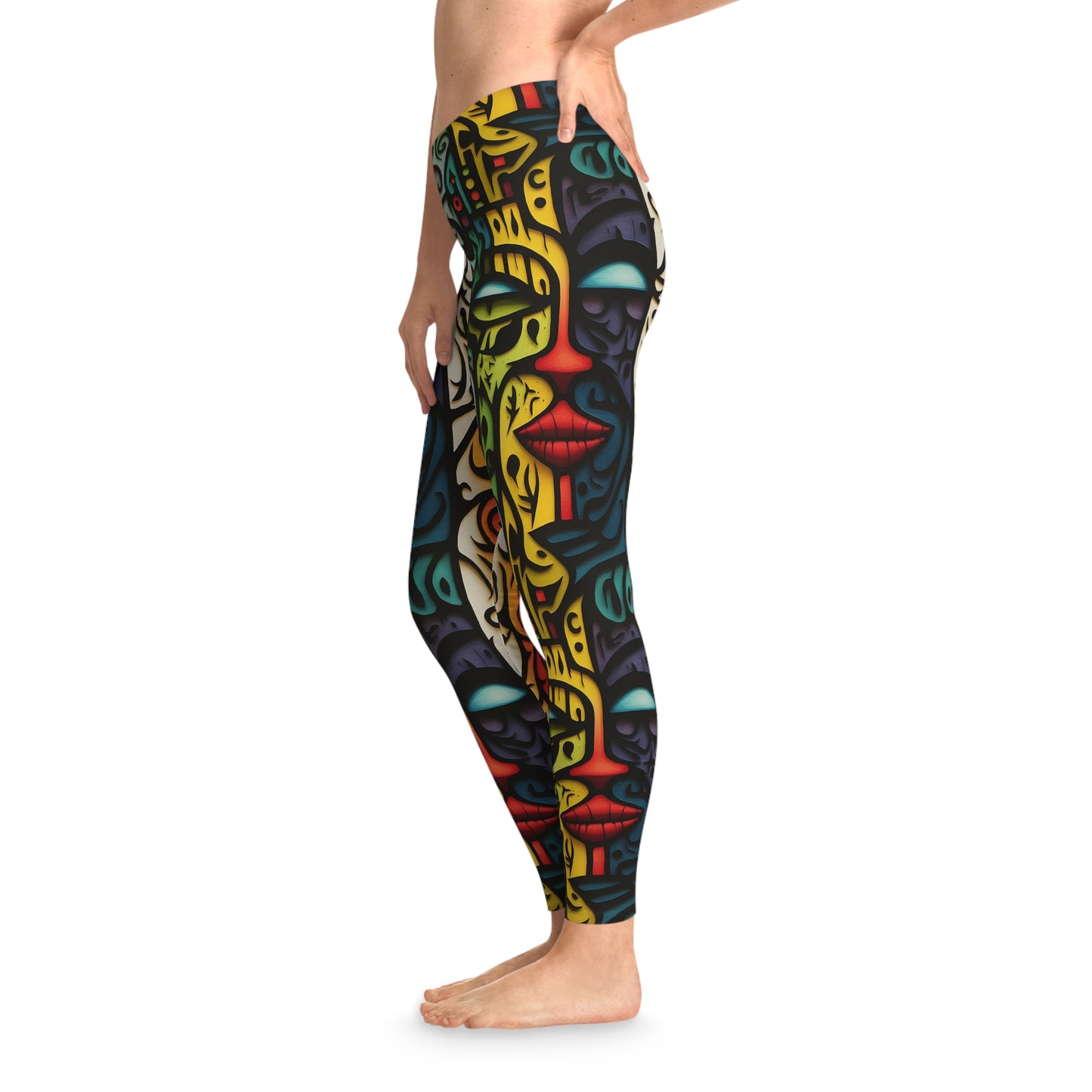 Left side view of unique colorful leggings with an abstract face design in bold, vibrant tones, offering a sleek and fun style for everyday wear.