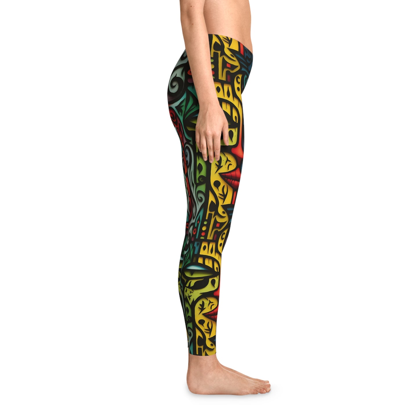 Right side view of colorful art leggings featuring a whimsical abstract face pattern in vibrant hues, designed for yoga, fitness, or casual outfits.