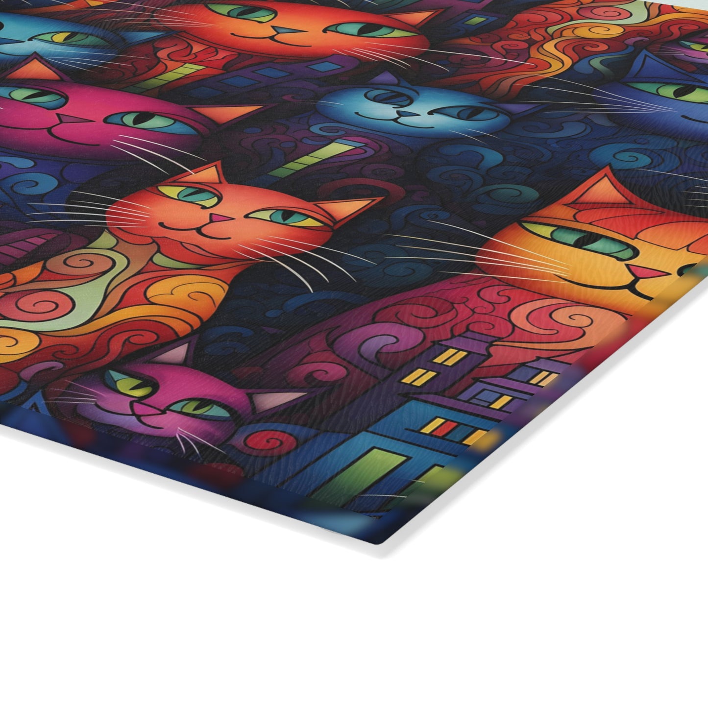 Close-up of decorative glass cutting board featuring cute colorful cats in a creative cityscape. Large size is .31 inches thick.