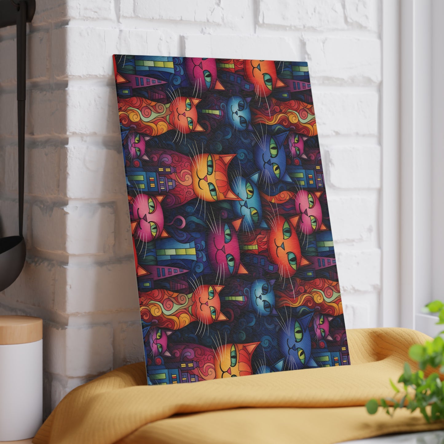 Decorative glass cutting board featuring artistic cat faces in a bold, modern city setting. Small size is 8 x 11 inches.