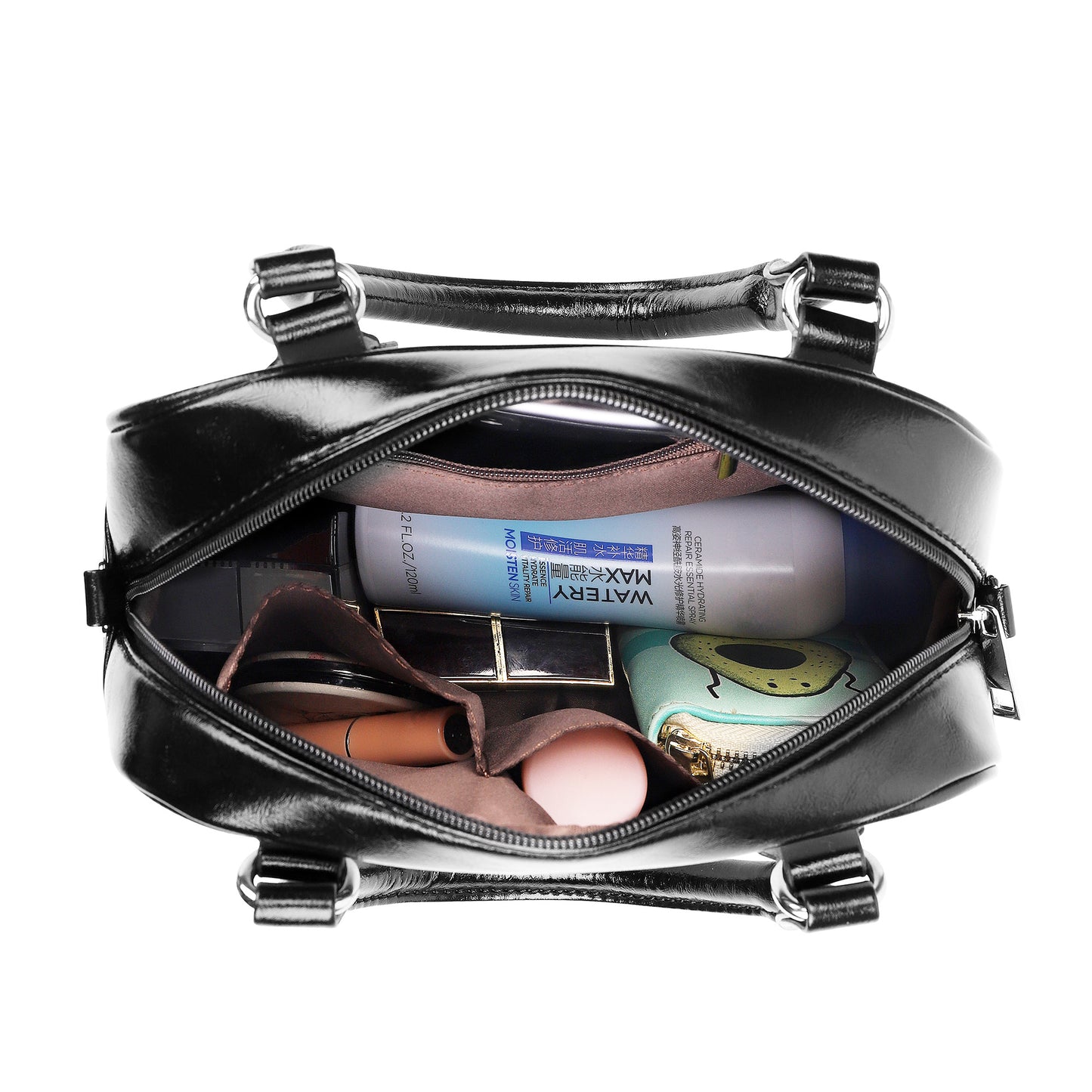 Top view of the handbag filled with everyday essentials, emphasizing its spacious interior and secure closure.