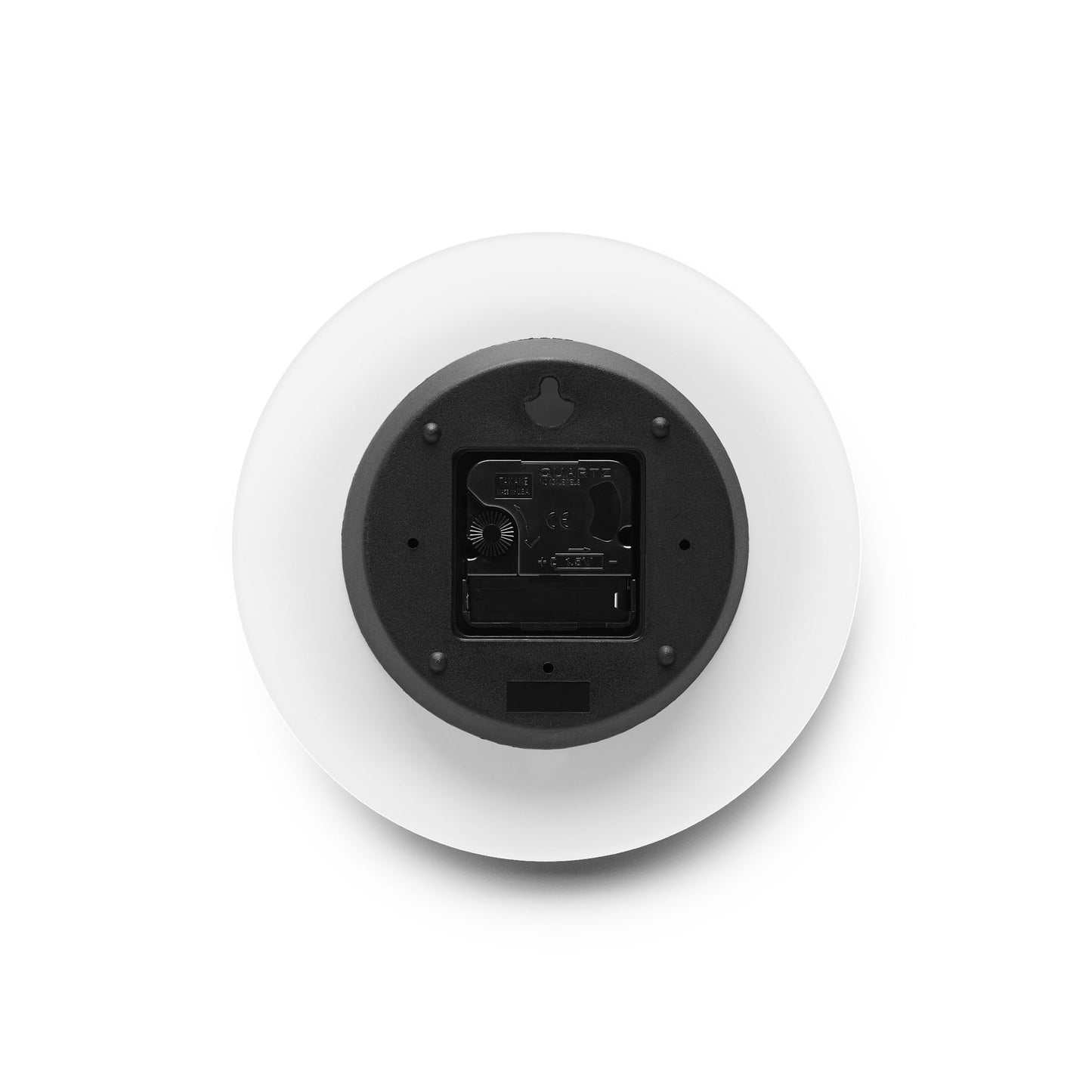Back view of small round acrylic wall clock with built in hanging slot and clock mechanism