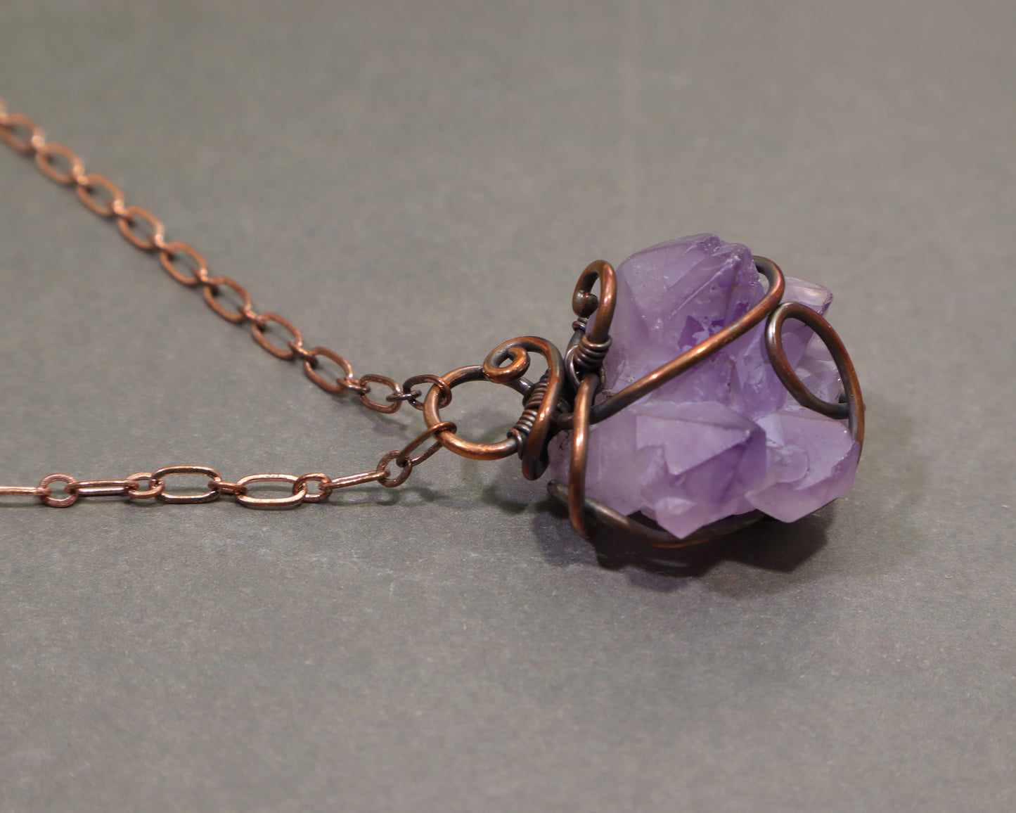 Handmade elestial amethyst necklace with rustic oxidized copper wire wrapping