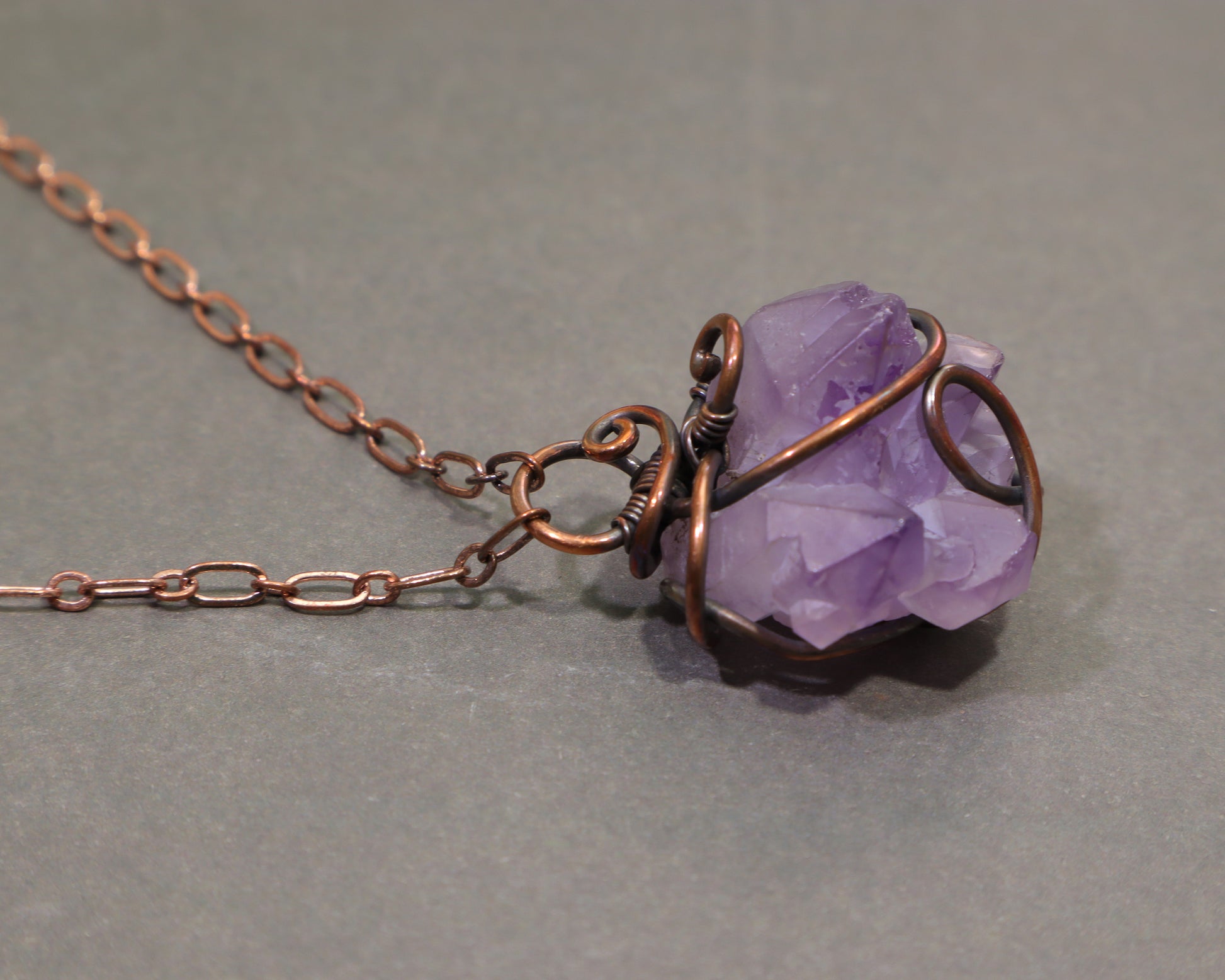 Handmade elestial amethyst necklace with rustic oxidized copper wire wrapping