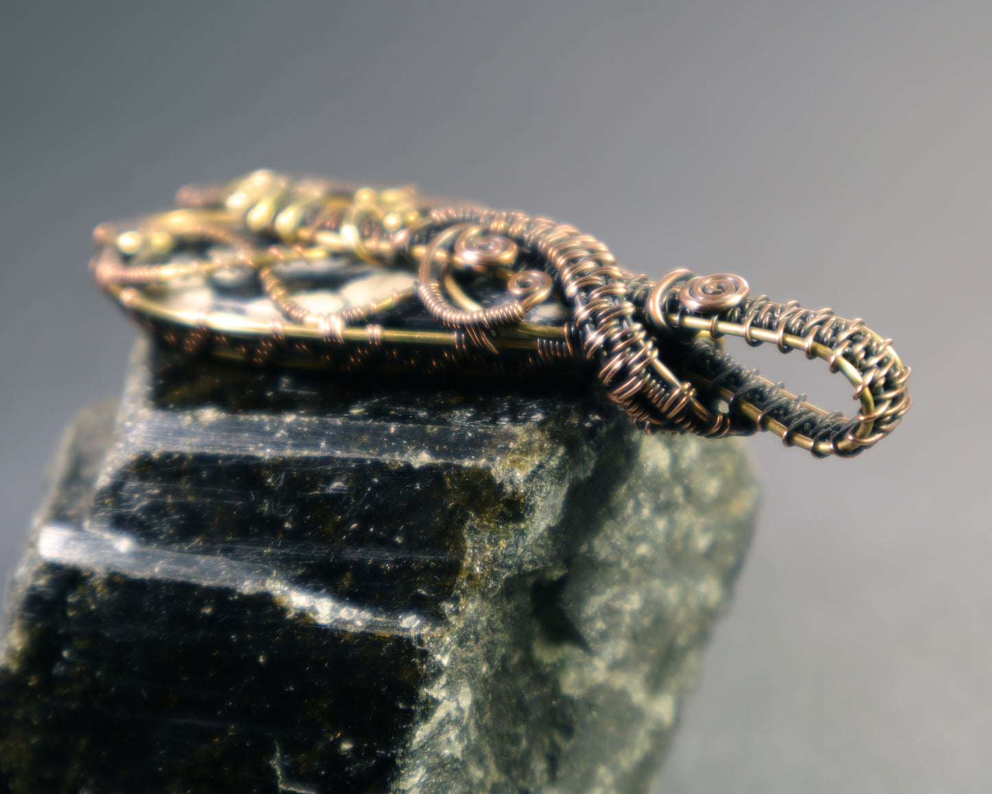 Back view of magnesite pendant featuring labyrinth wire design