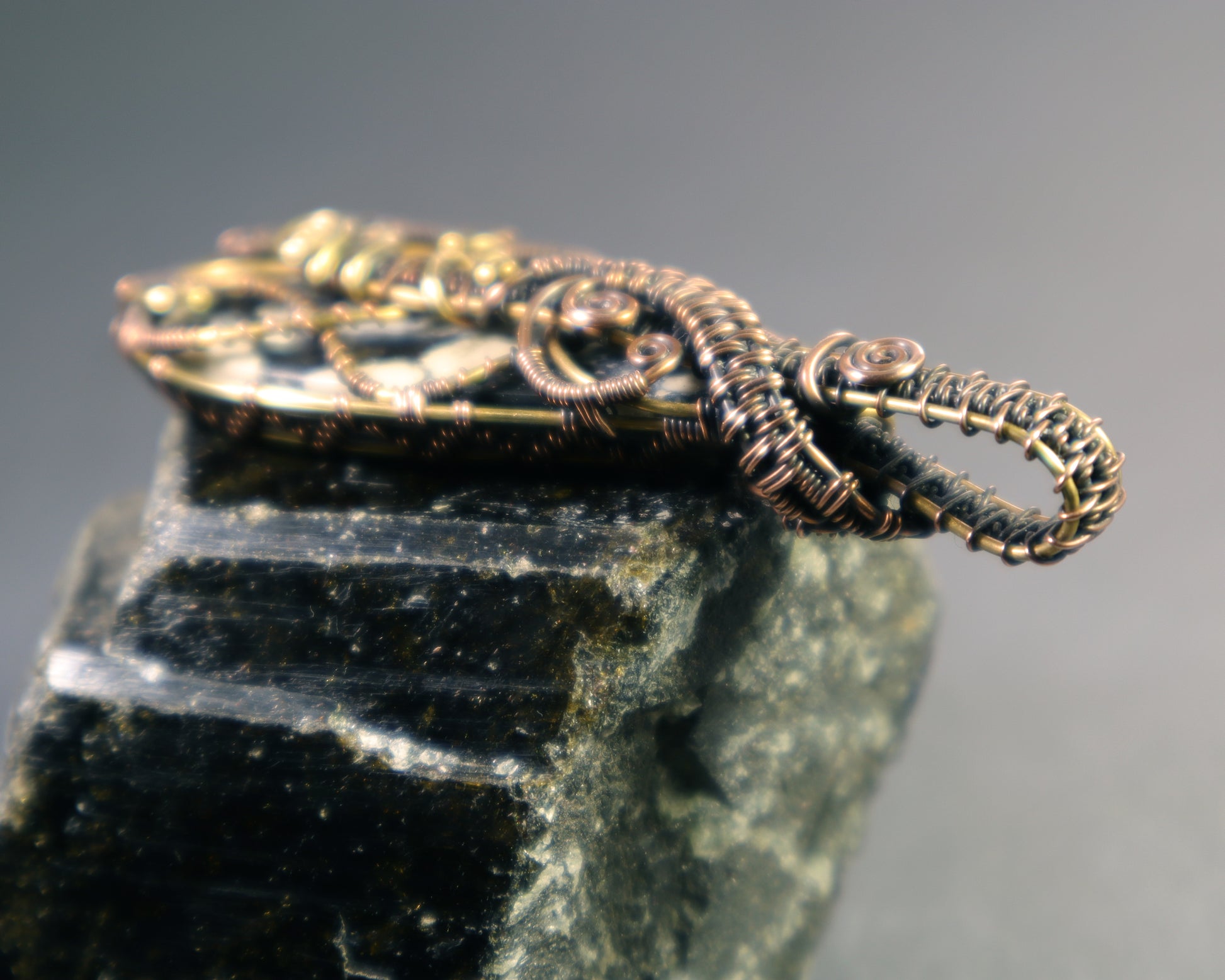 Back view of magnesite pendant featuring labyrinth wire design