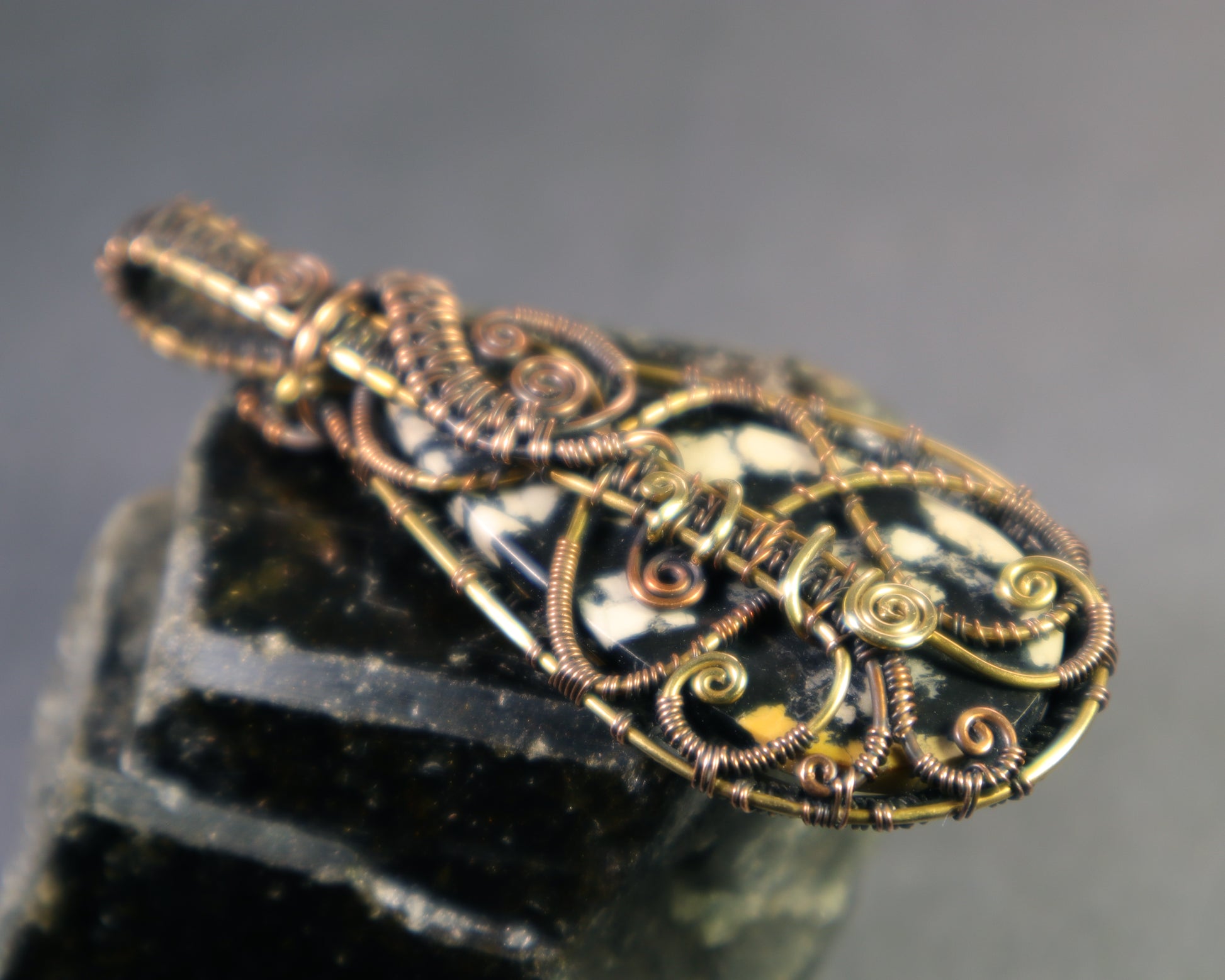Earth tone gemstone pendant inspired by connection and travel