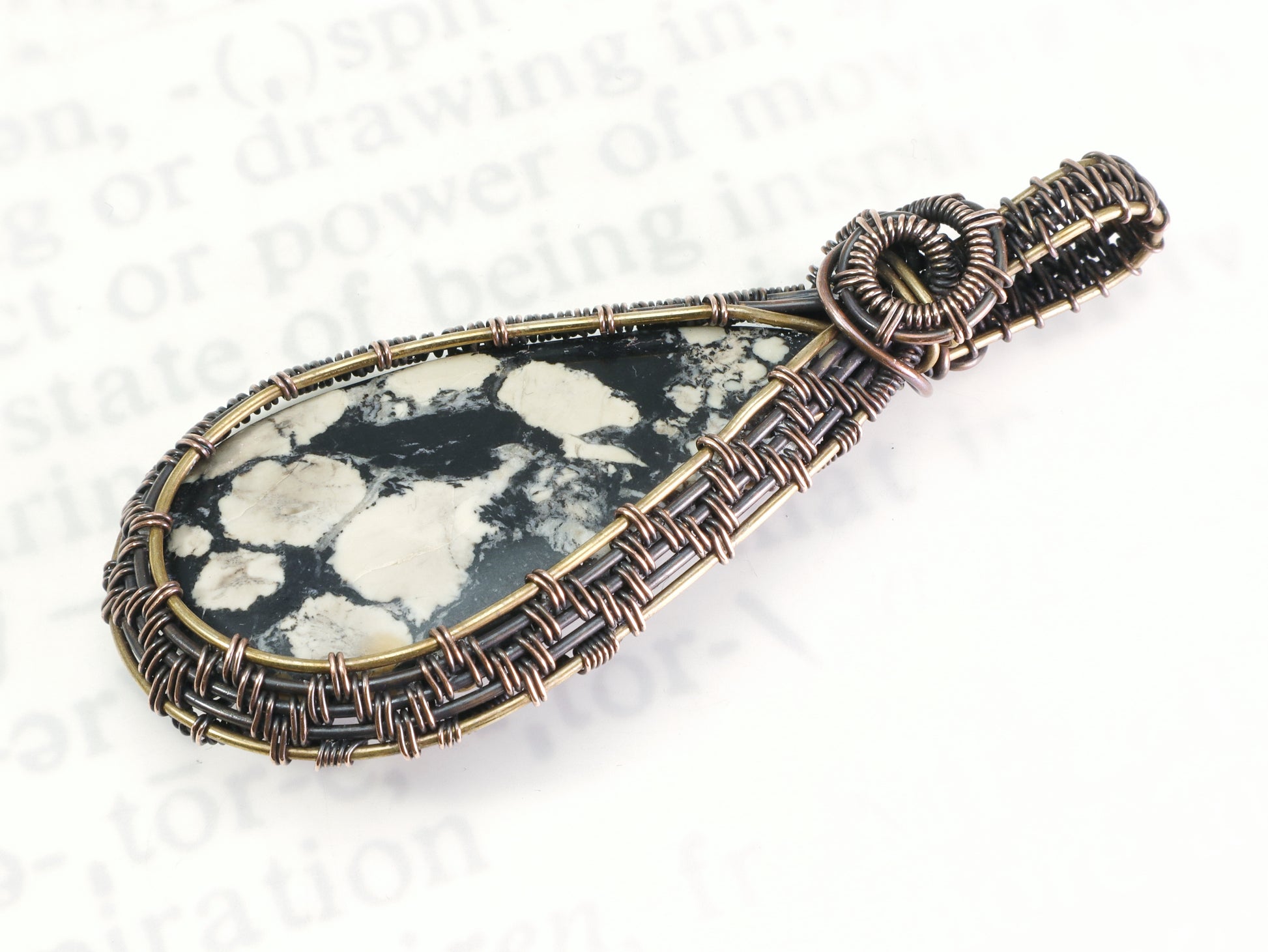 Wire woven fossil-like magnesite cabochon pendant
