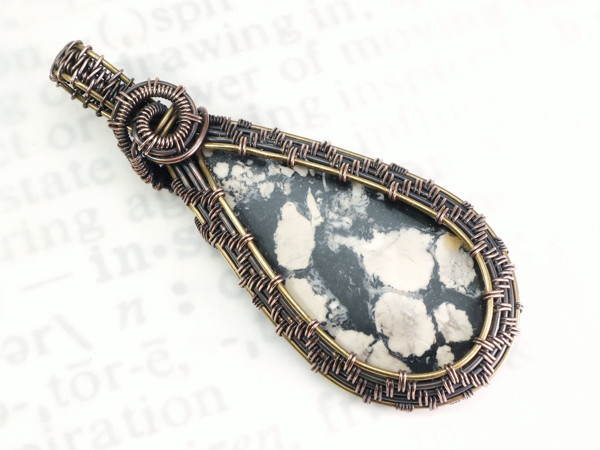 Artisan magnesite jewelry with intricate woven metalwork
