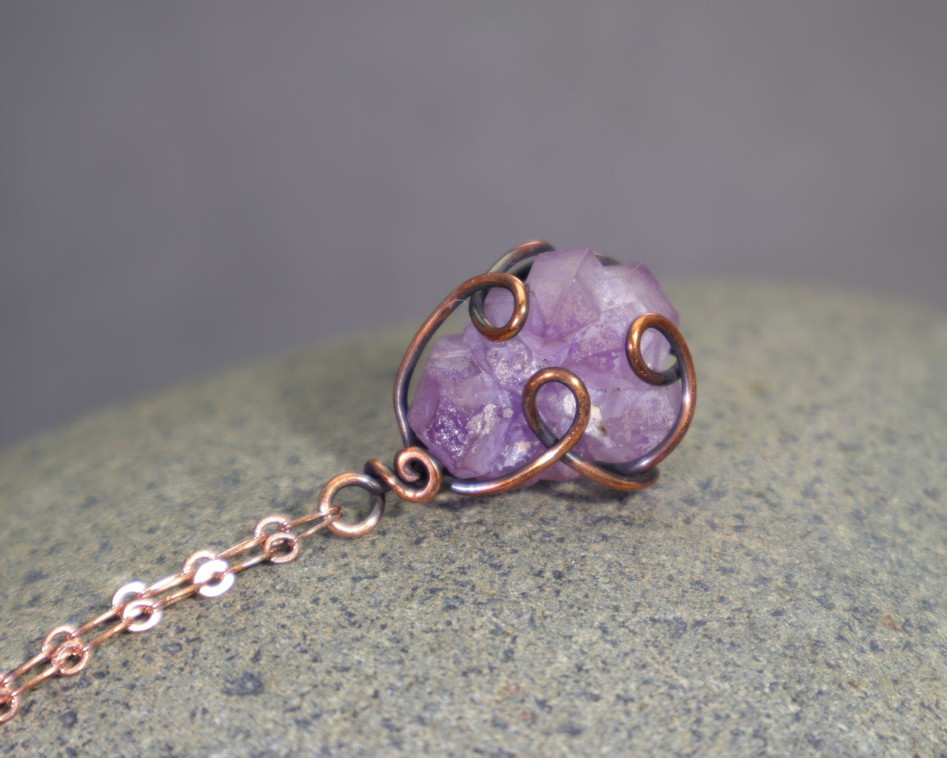 Rough purple amethyst crystal necklace with antiqued copper wire wrapping