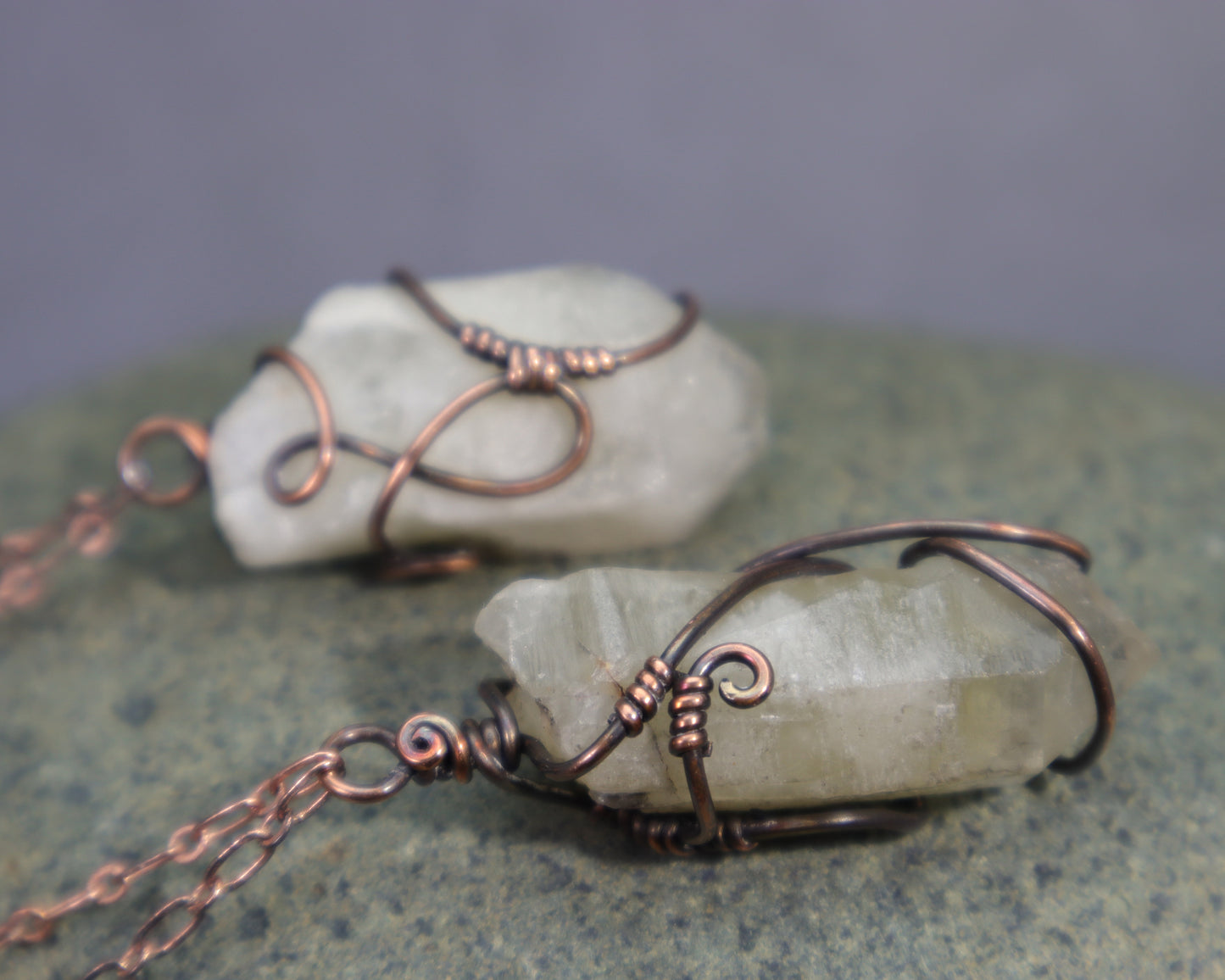 Natural rough citrine point pendants showing pale olive green crystals and copper wire wraps