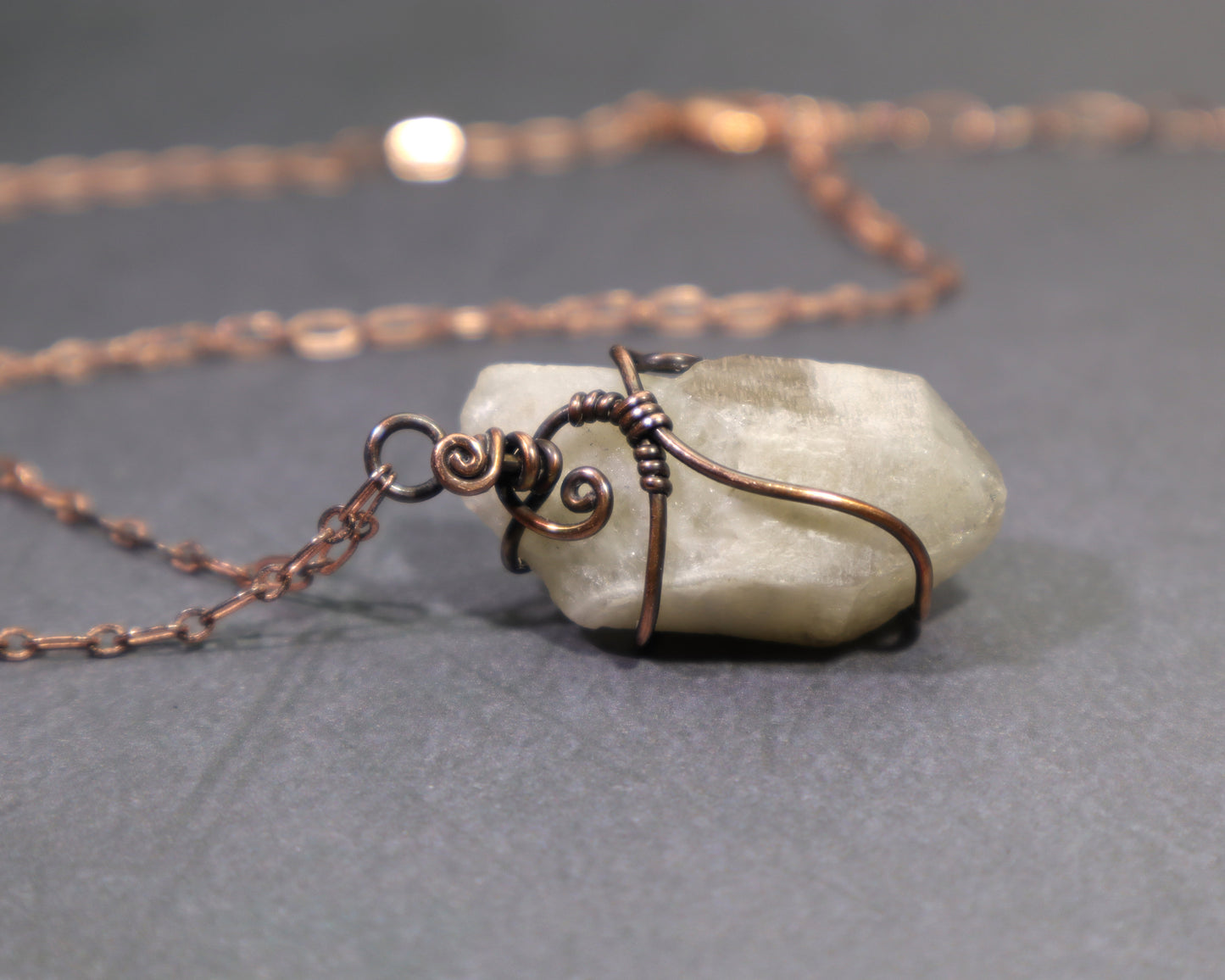 Back side of raw natural citrine crystal pendant wire wrapped in oxidized copper with adjustable copper chain