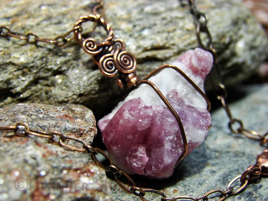 Raw pink tourmaline pendant necklace featuring natural rubellite crystals in white albite matrix wire wrapped in oxidized copper