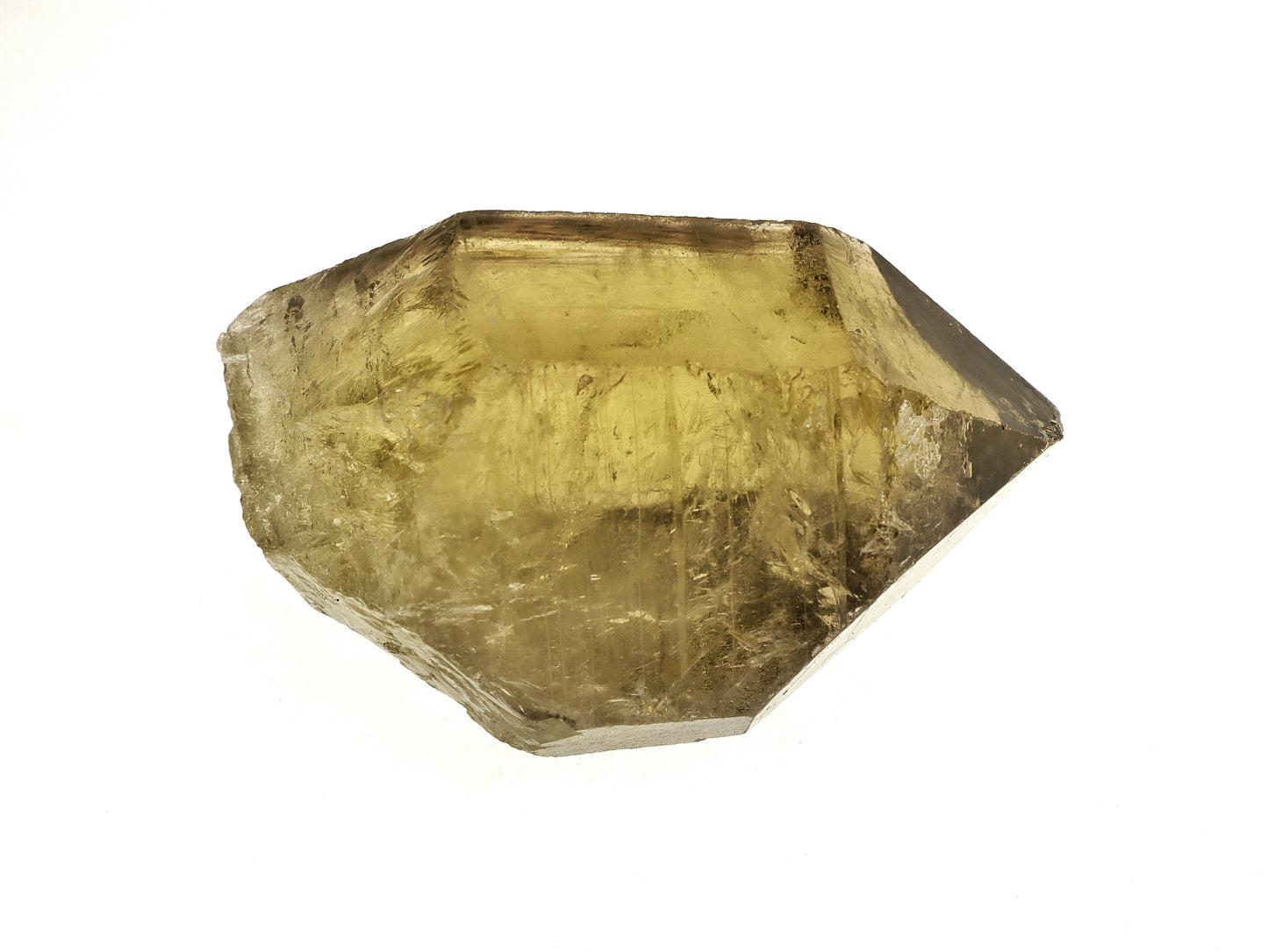 Raw yellow smoky lemon citrine crystal on a white background