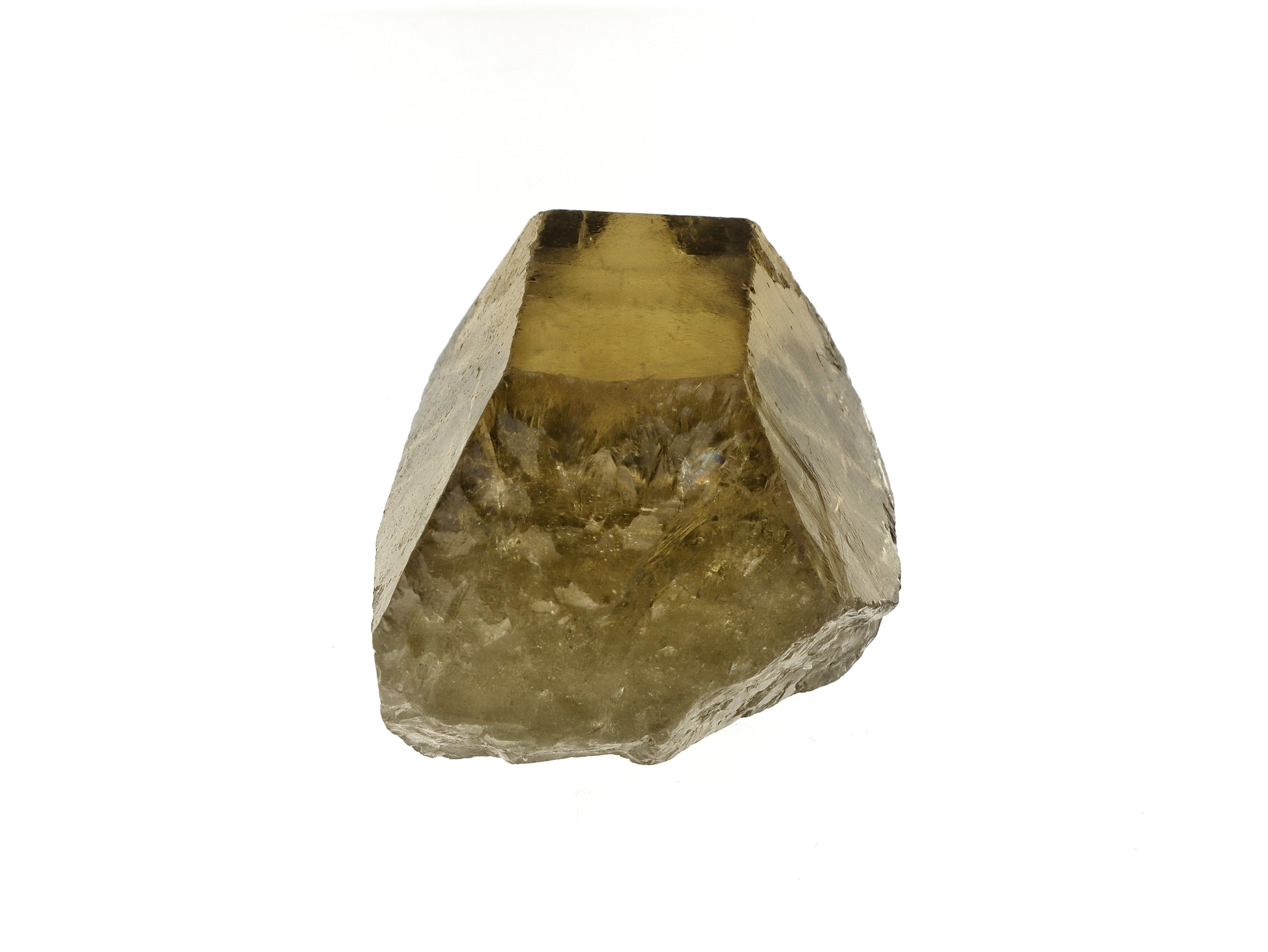 Close up of the base of a raw citrine crystal on a white background