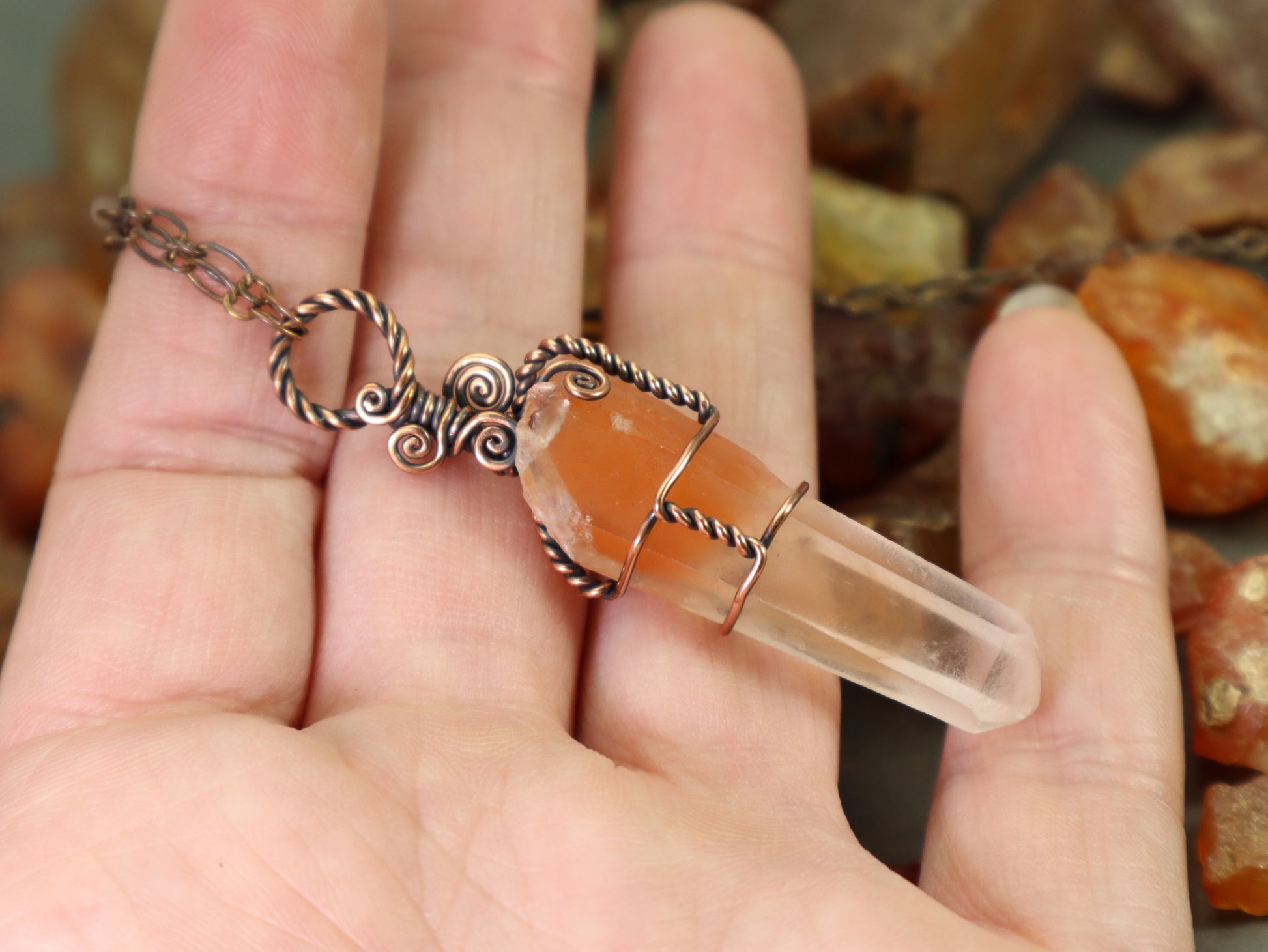Hand polished red phantom quartz crystal necklace in copper wire