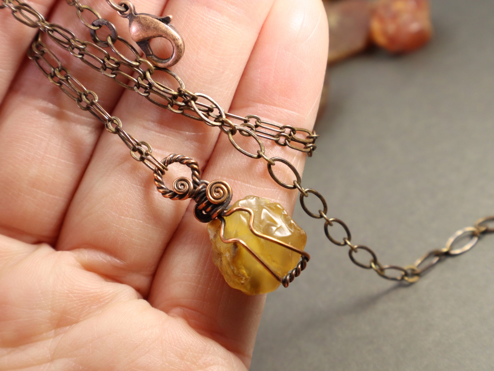 Adjustable copper chain necklace with raw carnelian crystal pendant