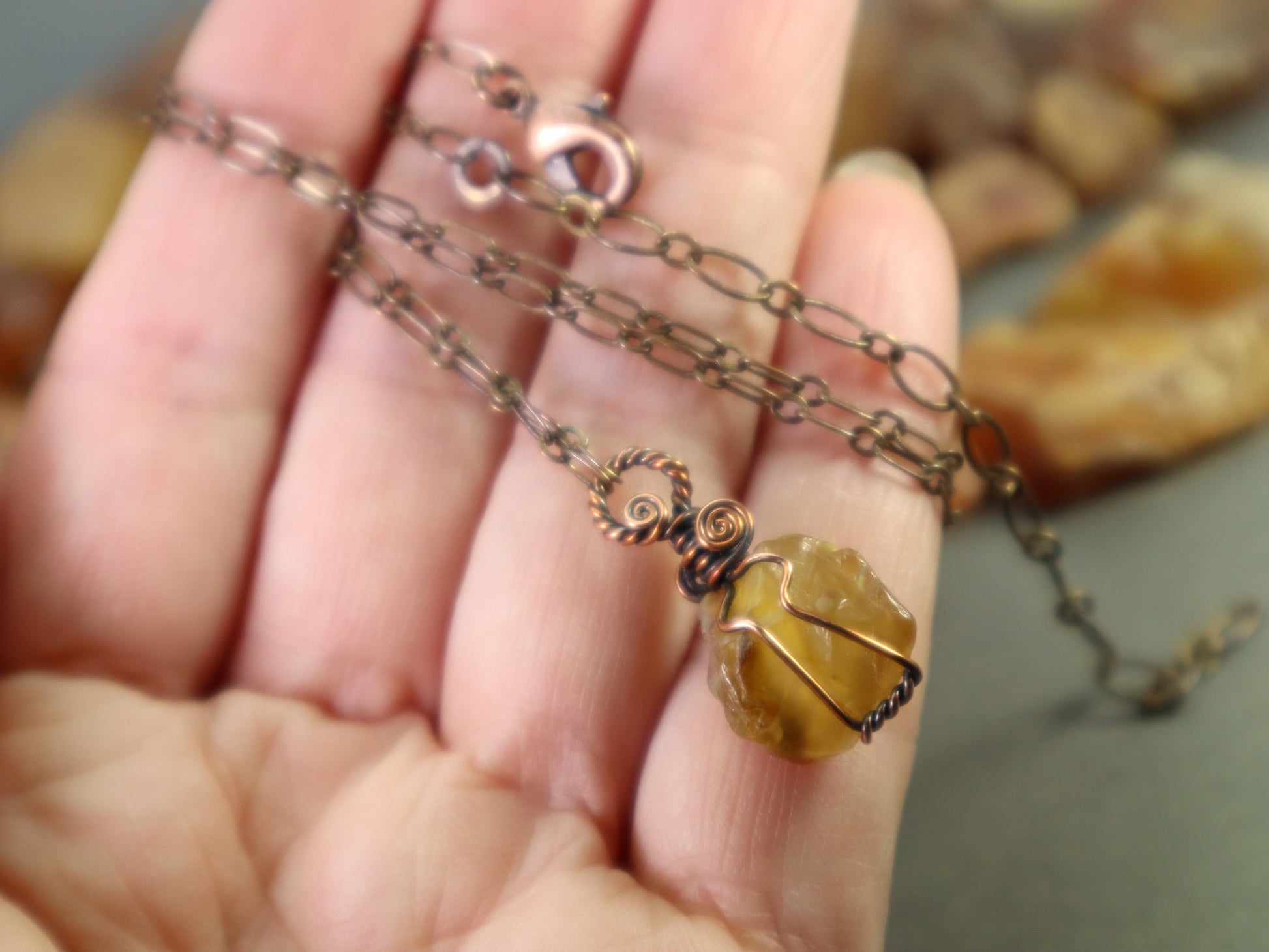 Handmade raw carnelian gemstone necklace with oxidized copper wire wrap