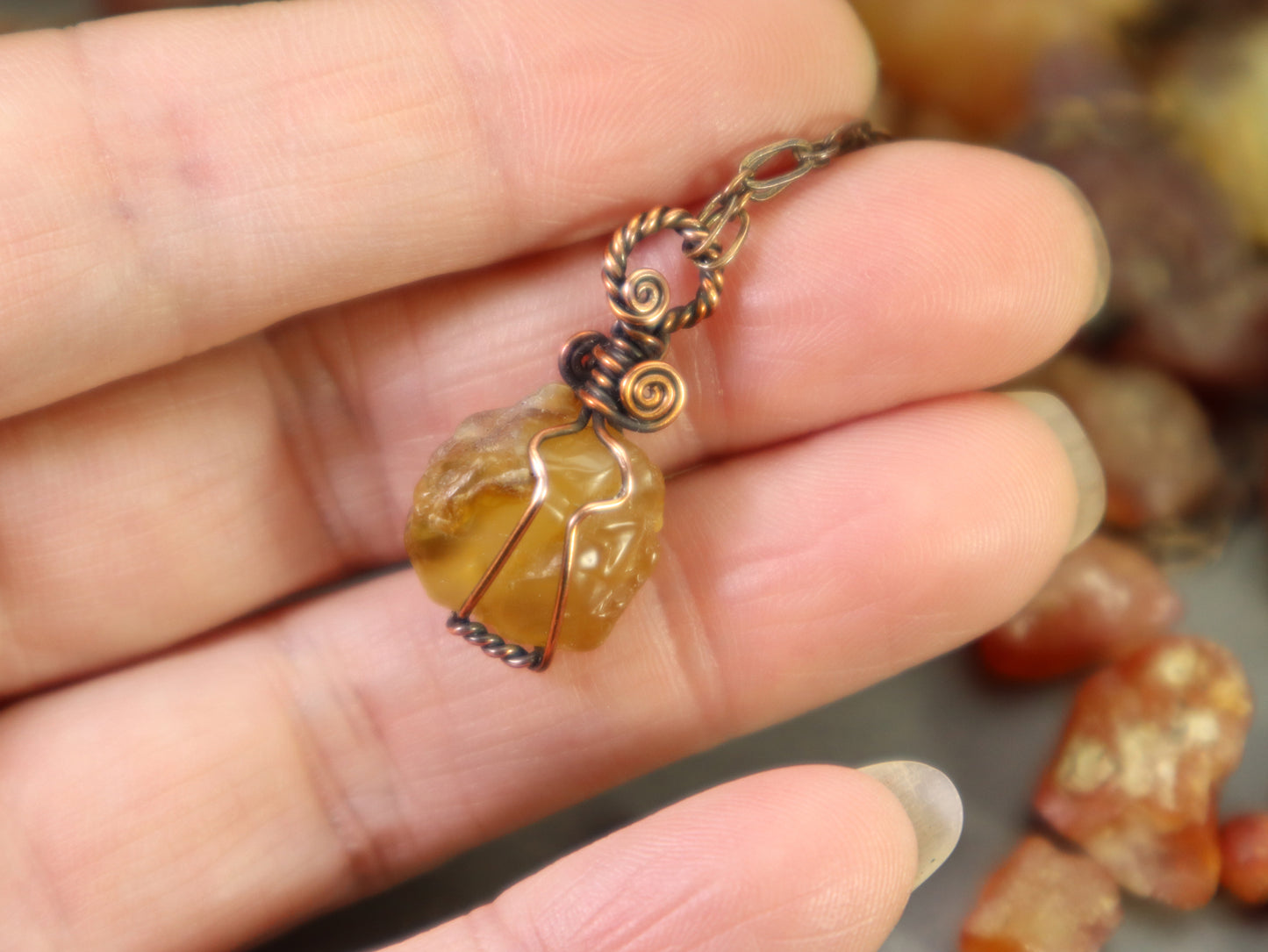 Handmade copper necklace featuring natural rough carnelian crystal