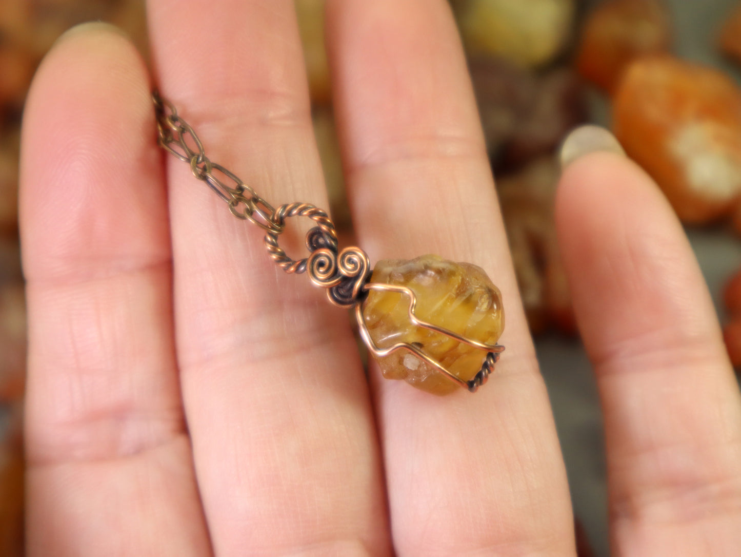 Natural rough carnelian agate gemstone wrapped in oxidized copper