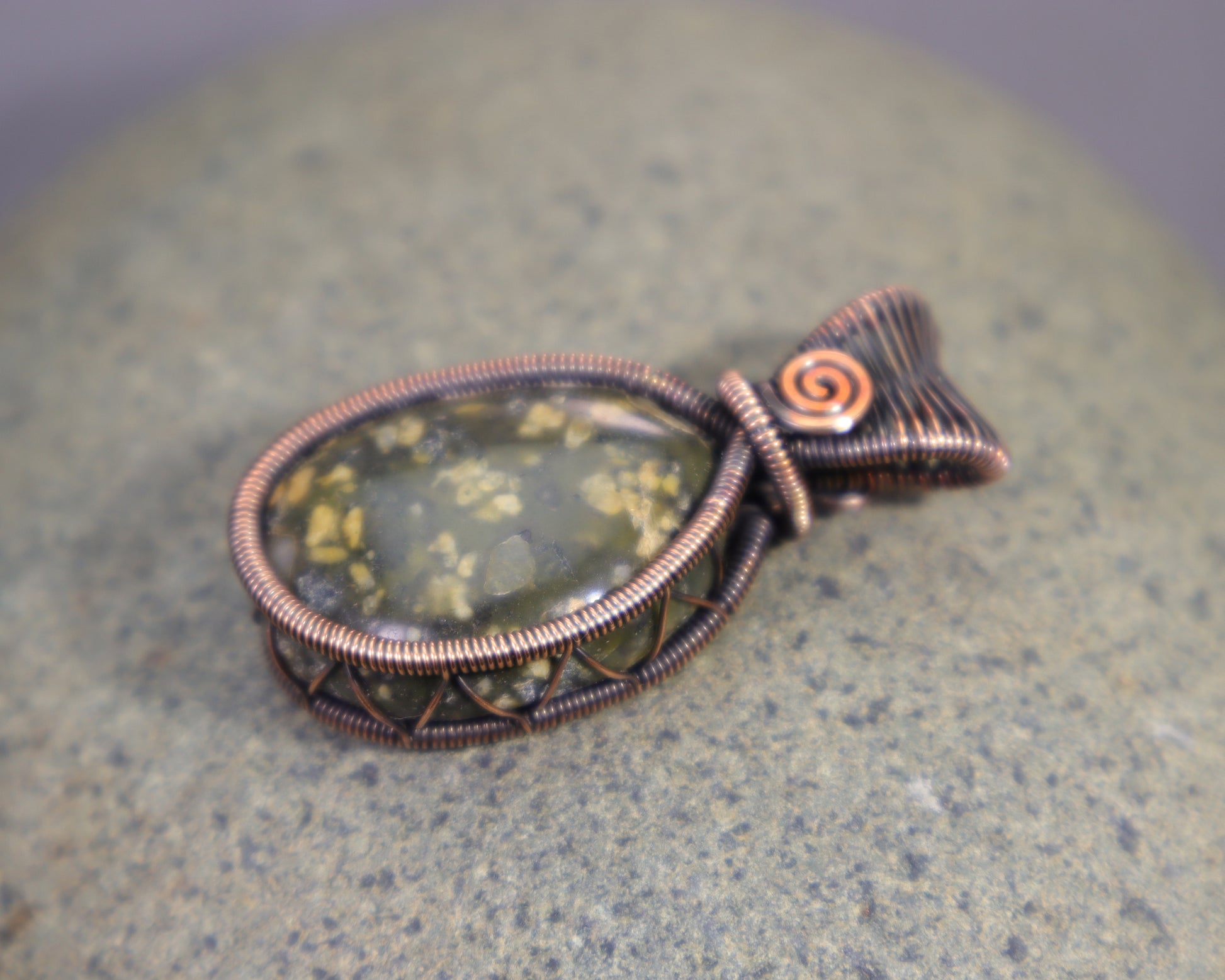 Handmade green jasper gemstone pendant with copper wire weaving