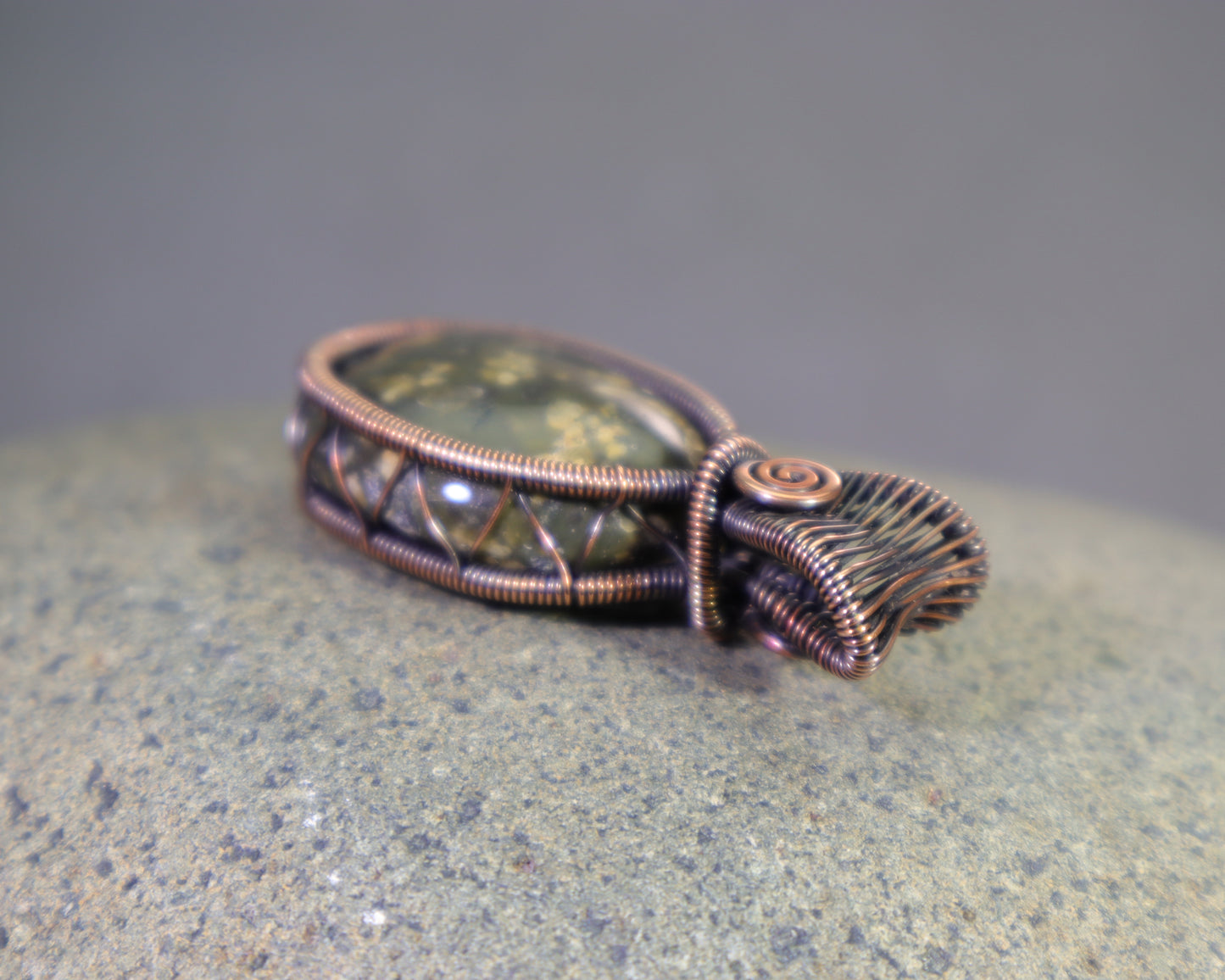 Natural olive green jasper pendant with detailed wirework
