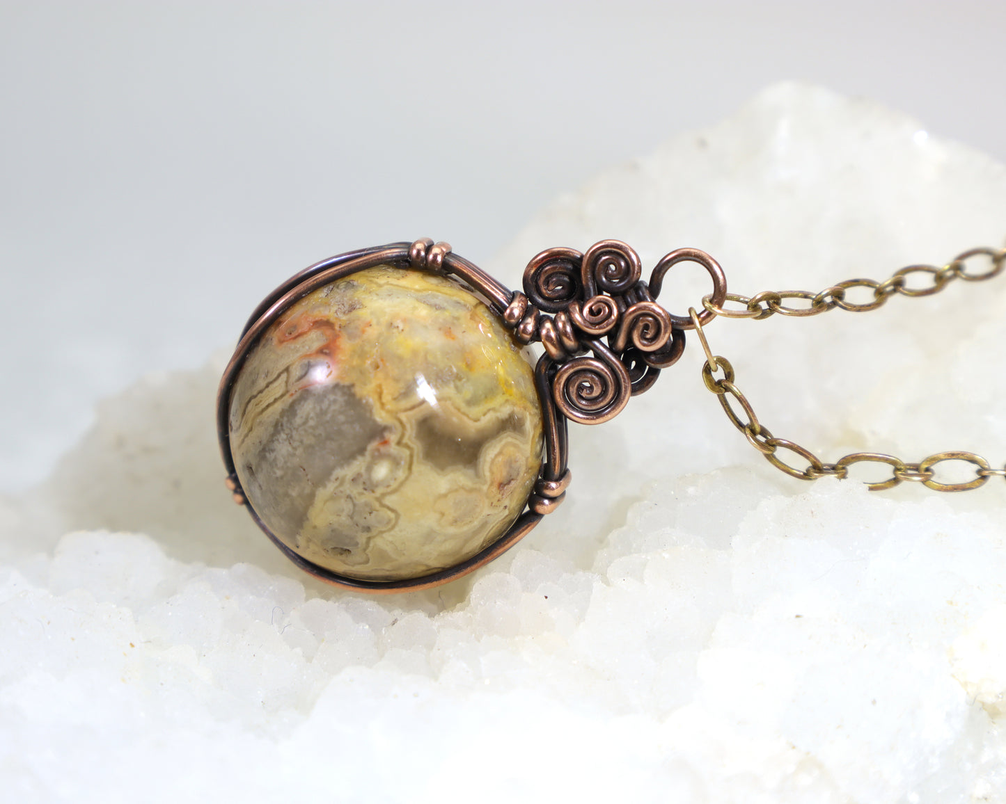 Yellow crazy lace agate sphere necklace wire wrapped in oxidized copper
