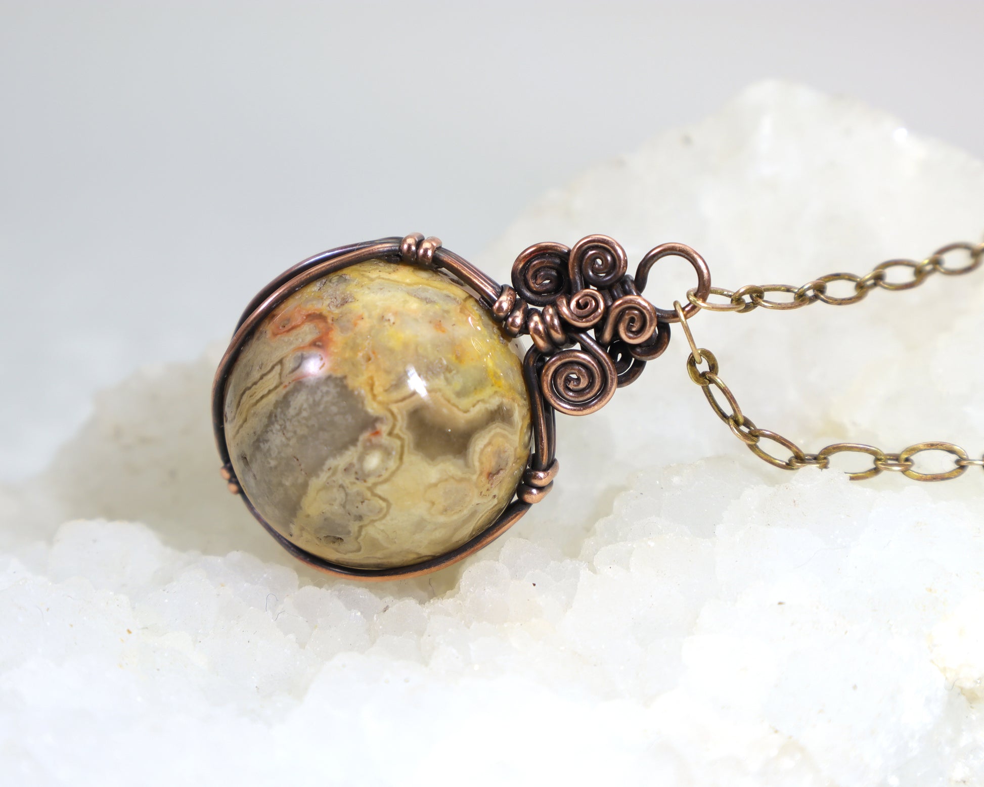Yellow crazy lace agate sphere necklace wire wrapped in oxidized copper