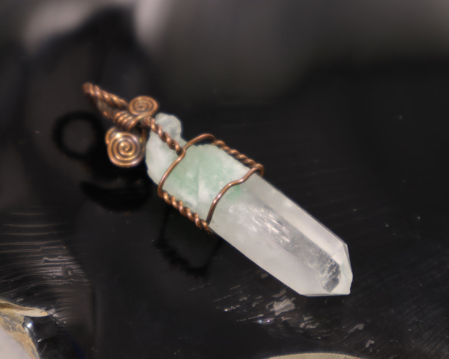 Raw healing green phantom quartz crystal point wrapped in oxidized copper wire
