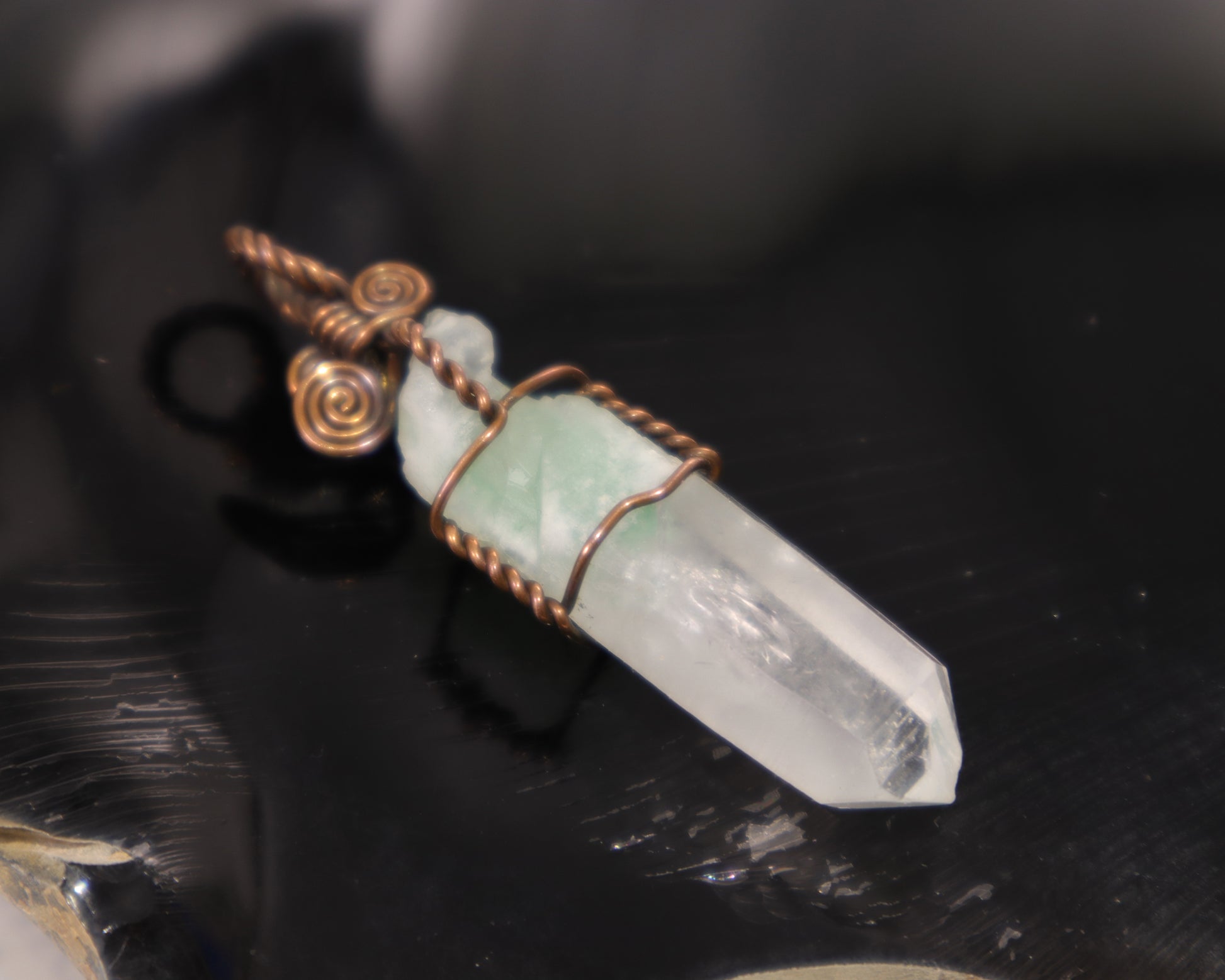Raw healing green phantom quartz crystal point wrapped in oxidized copper wire