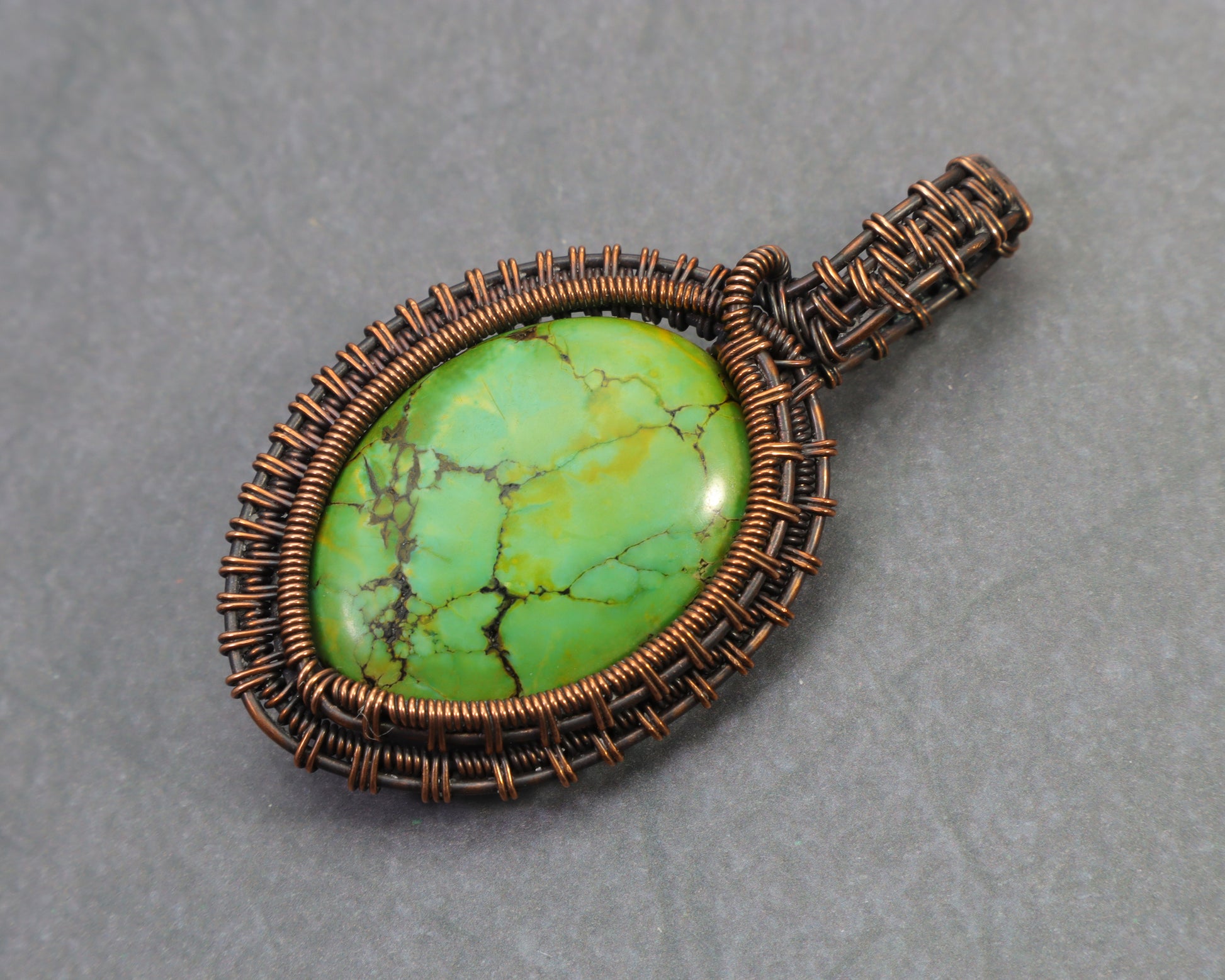 Green imperial jasper pendant handcrafted in copper wire weave