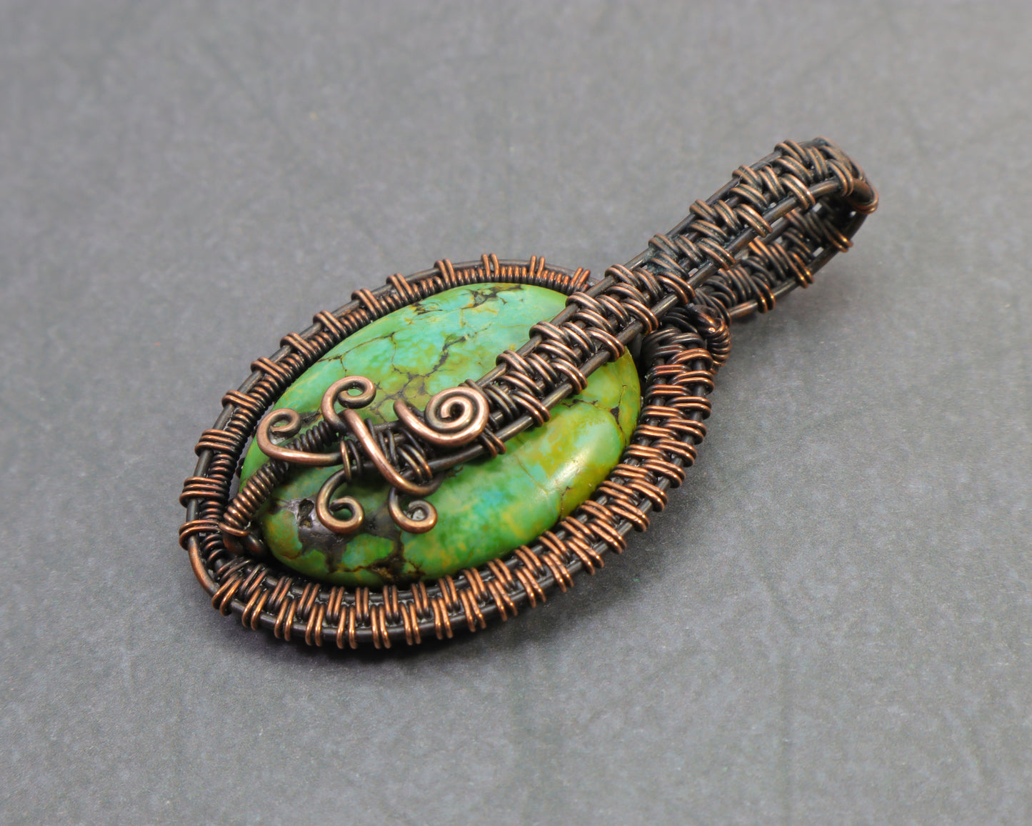 Copper wire woven pendant featuring green variscite