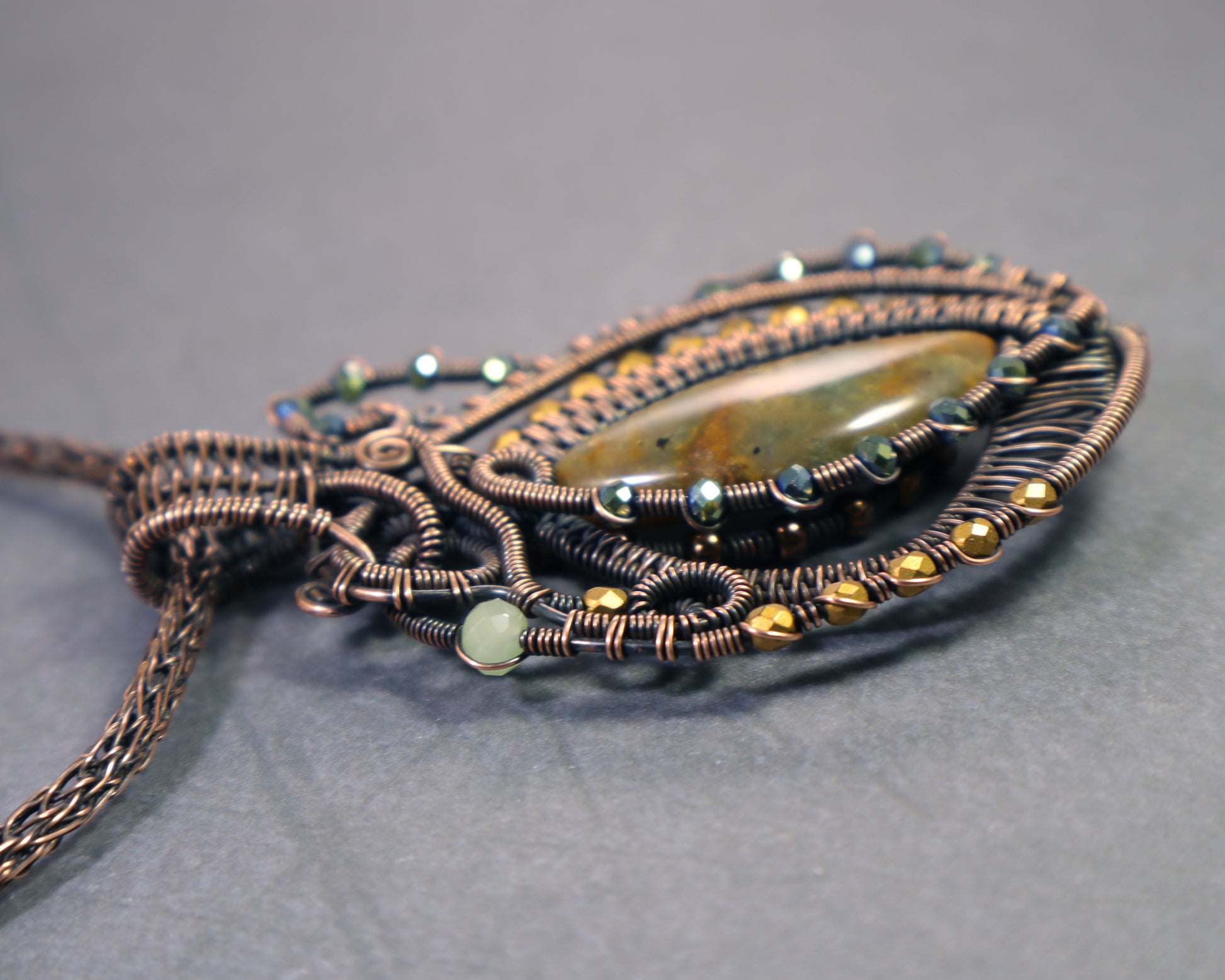 Artisan moss agate necklace pendant with intricate wirework
