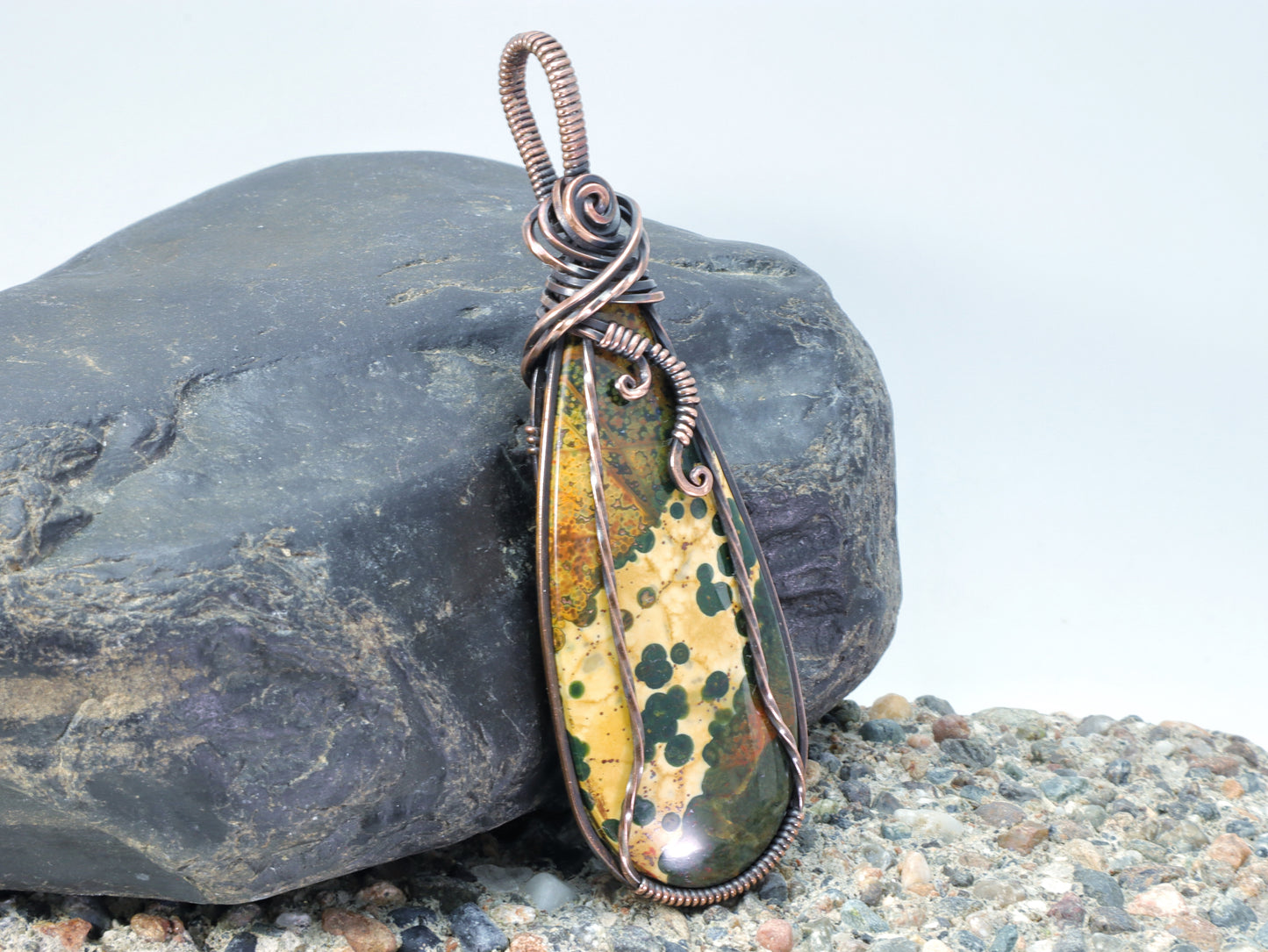 Wire wrapped Ocean Jasper cabochon with yellow and green patterns
