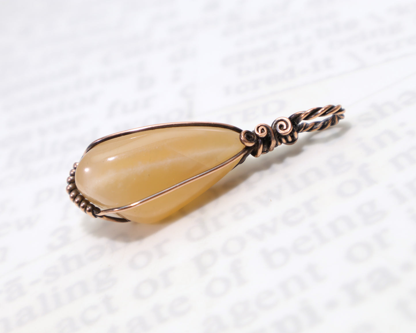 Nickel free peach moonstone wire wrapped pendant handmade by artist