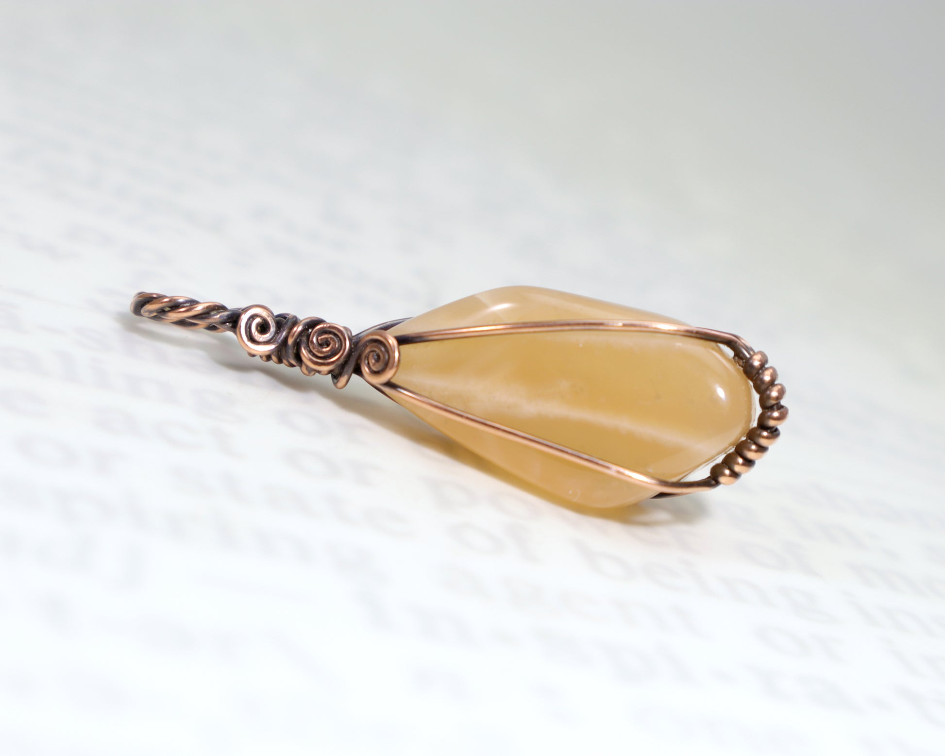 Peach moonstone pendant with warm coral and cream tones