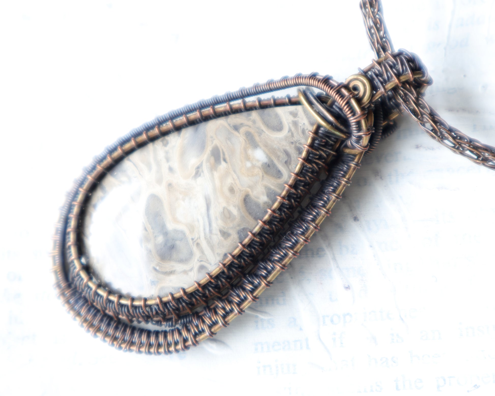 Petrified palmwood fossil pendant wire woven in copper and brass
