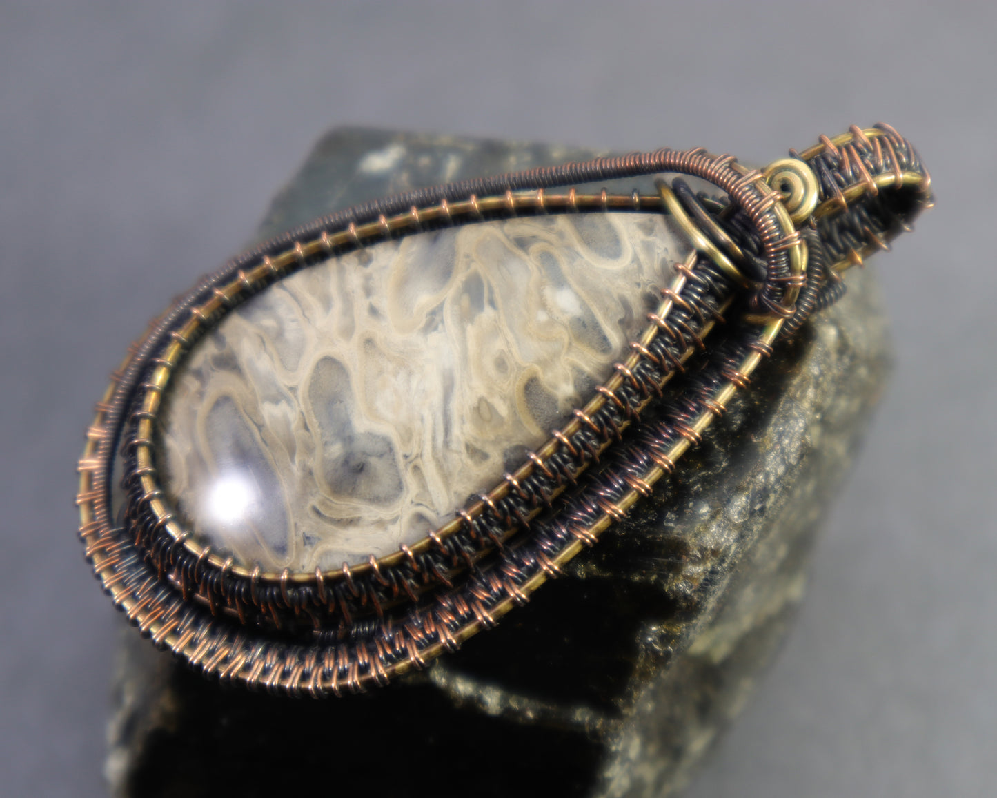 One of a kind petrified palmwood pendant in antiqued copper and brass