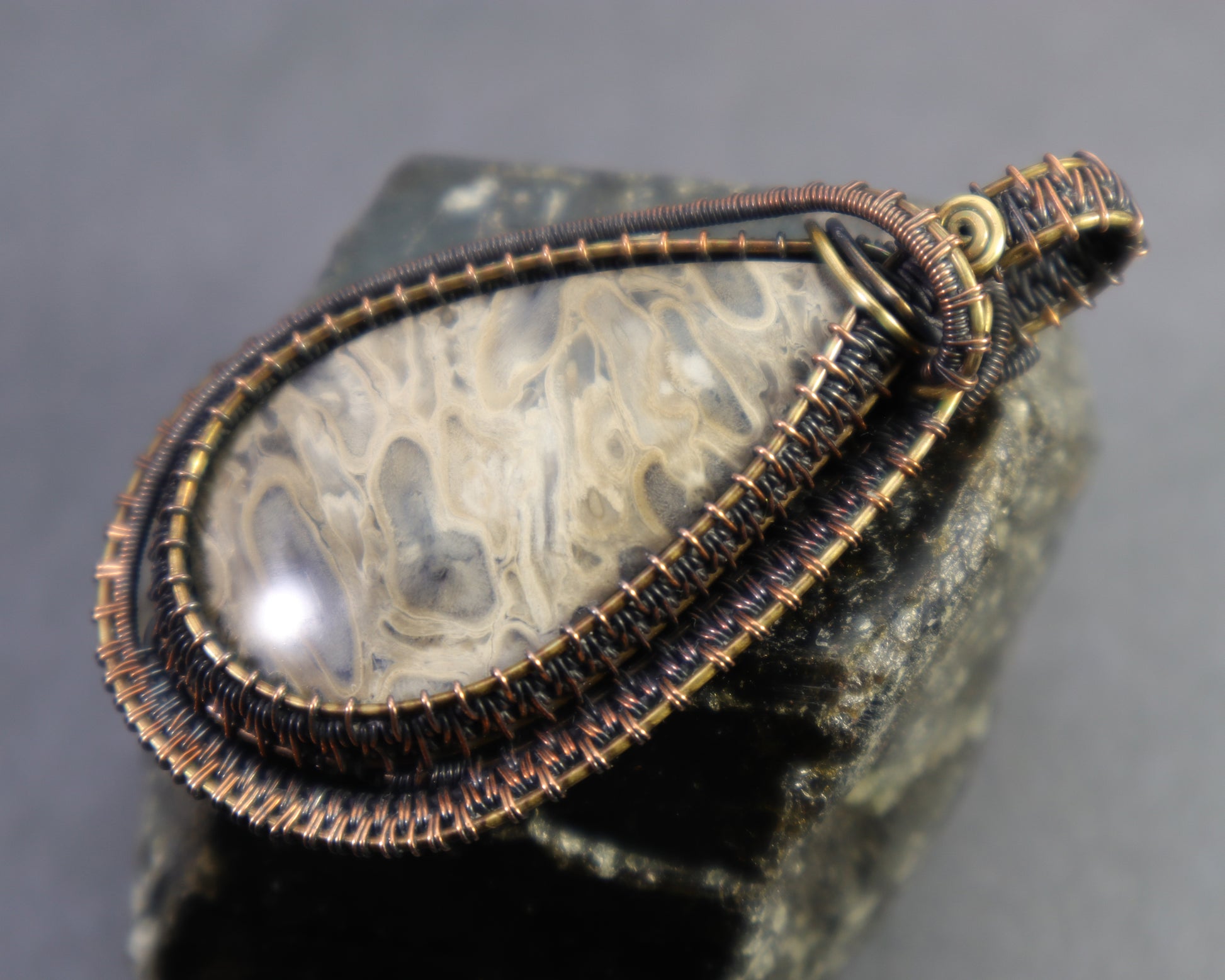 One of a kind petrified palmwood pendant in antiqued copper and brass