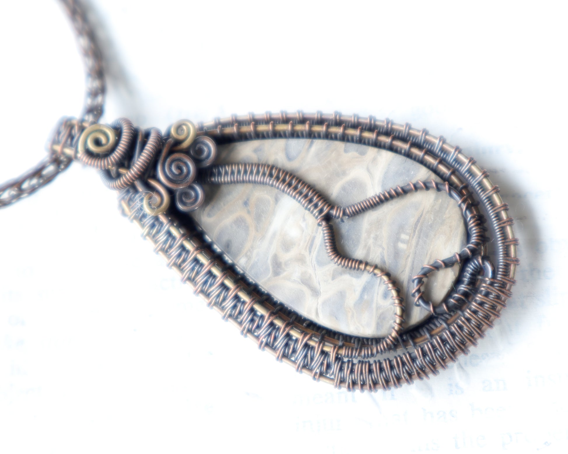 Back View of Fossilized palmwood cabochon pendant with art nouveau wirework