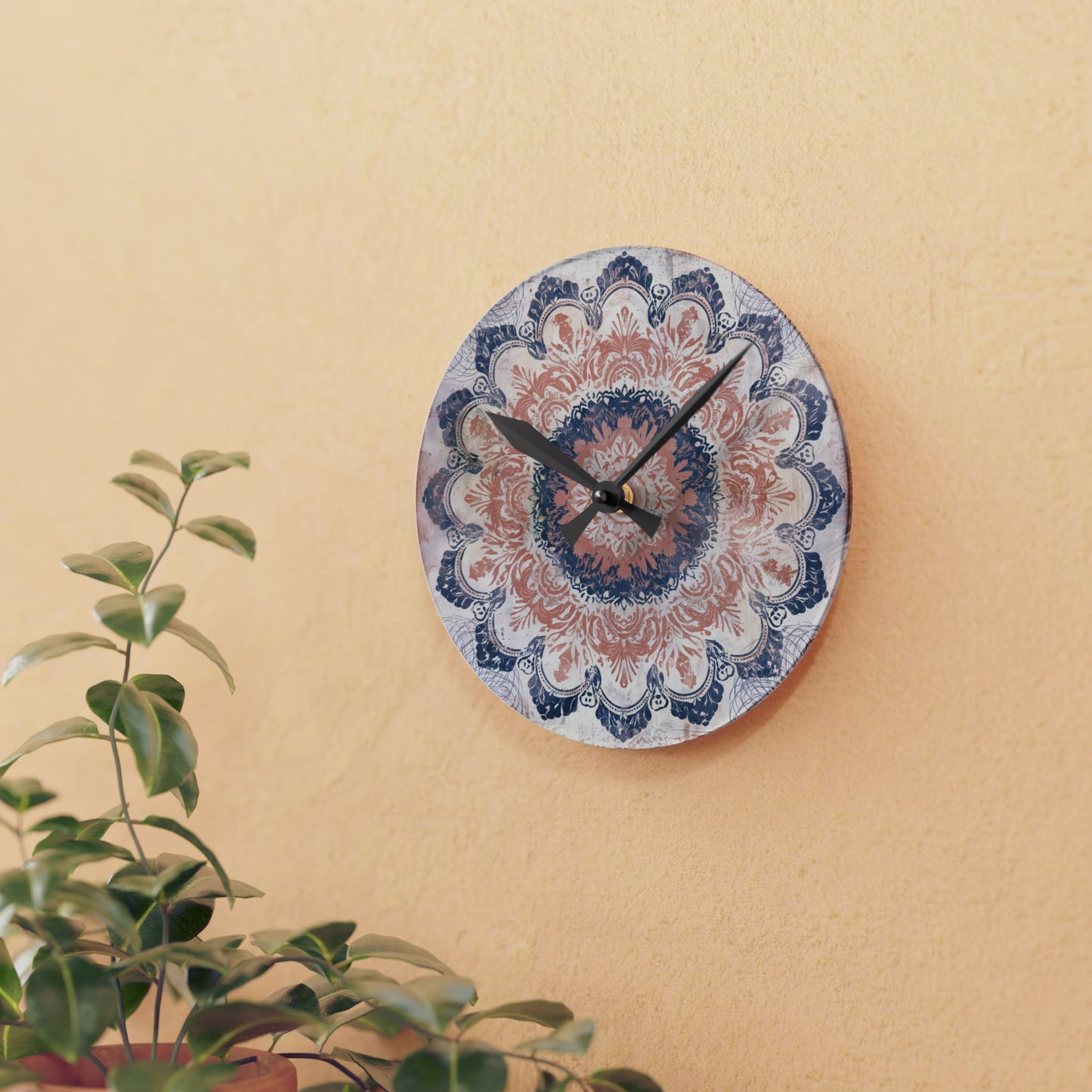 Small decorative mandala wall clock displayed on warm beige wall with indoor plant