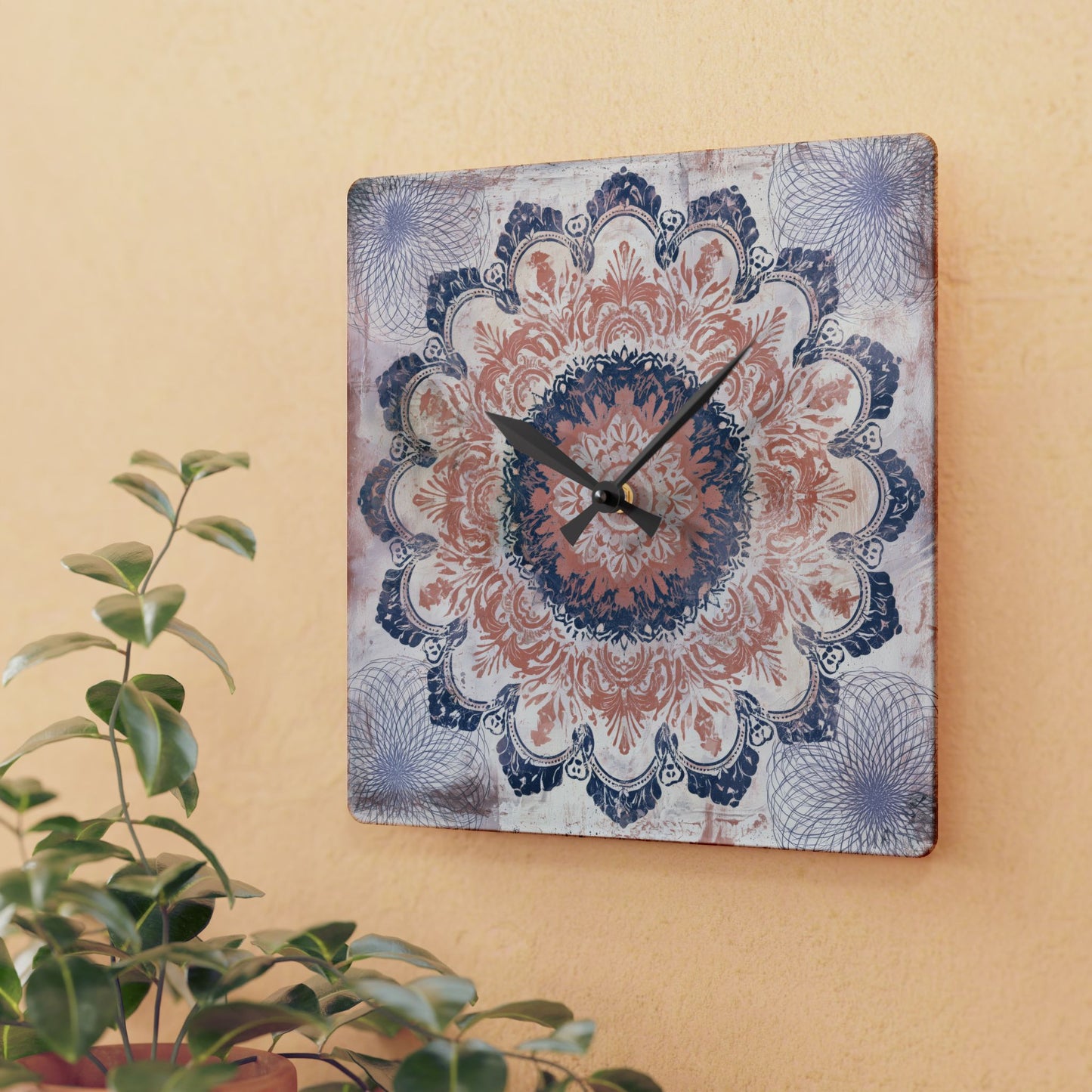 Boho mandala acrylic wall clock displayed on warm beige wall with houseplant decor