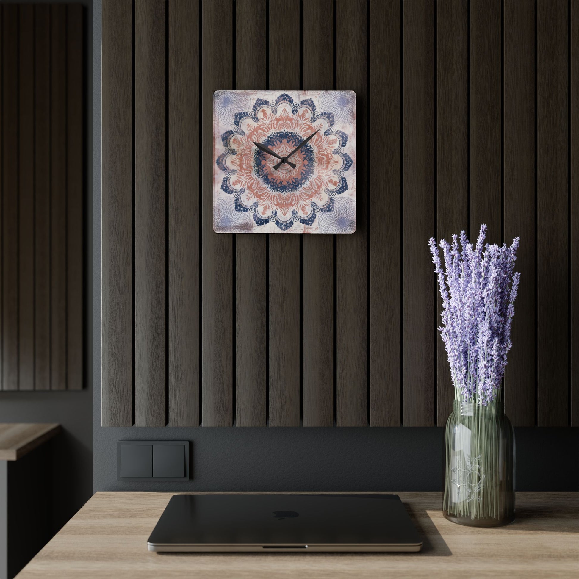 Boho acrylic wall clock with mandala artwork hanging on modern dark wood accent wall