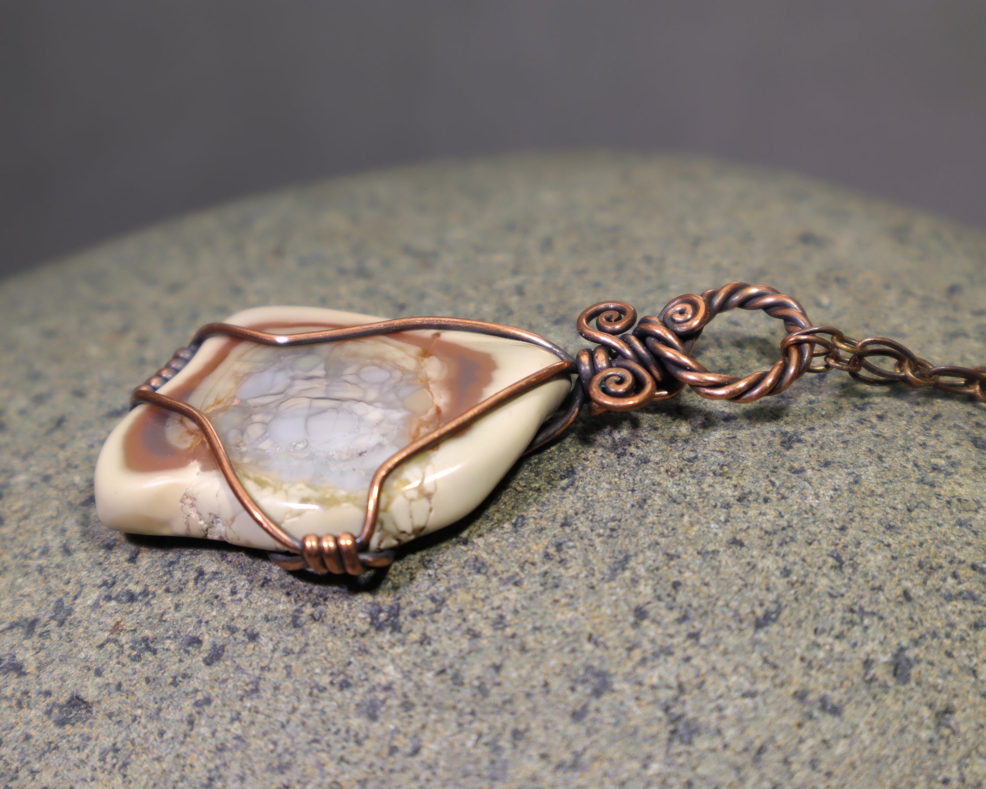 Handmade Polychrome Jasper pendant wrapped in pure copper wire with cream and brown natural patterns