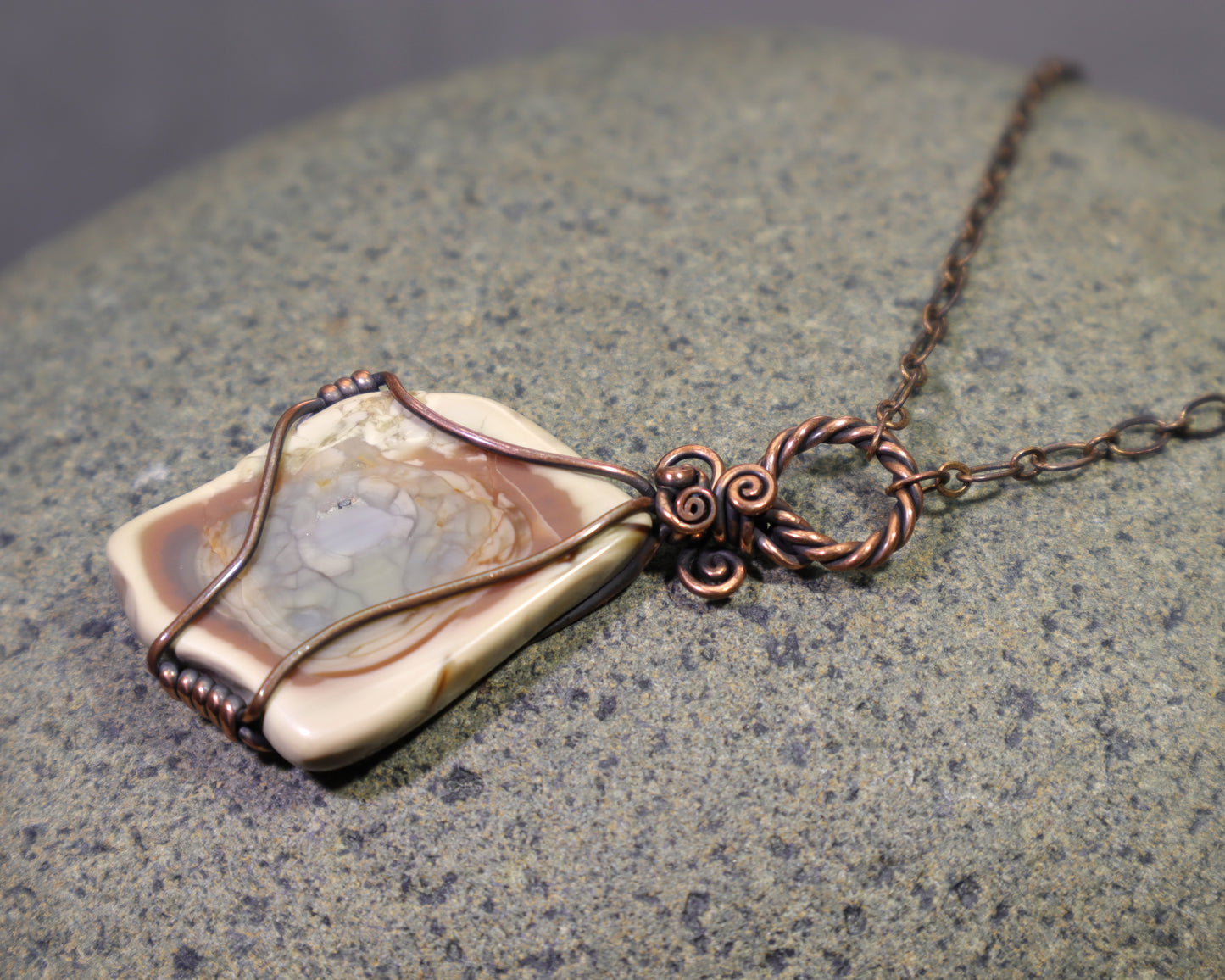 Rustic copper necklace featuring a natural Polychrome Jasper stone with scenic desert-like patterns