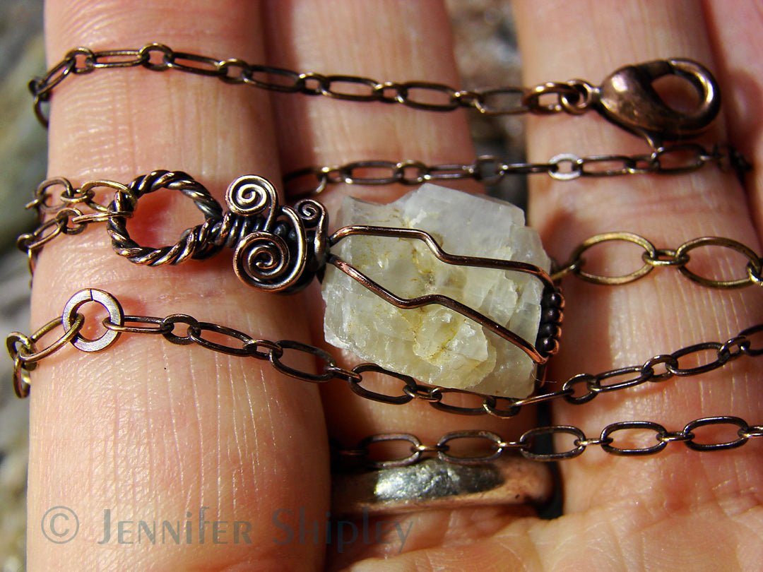 Raw moonstone gemstone necklace with rustic copper wire wrapping