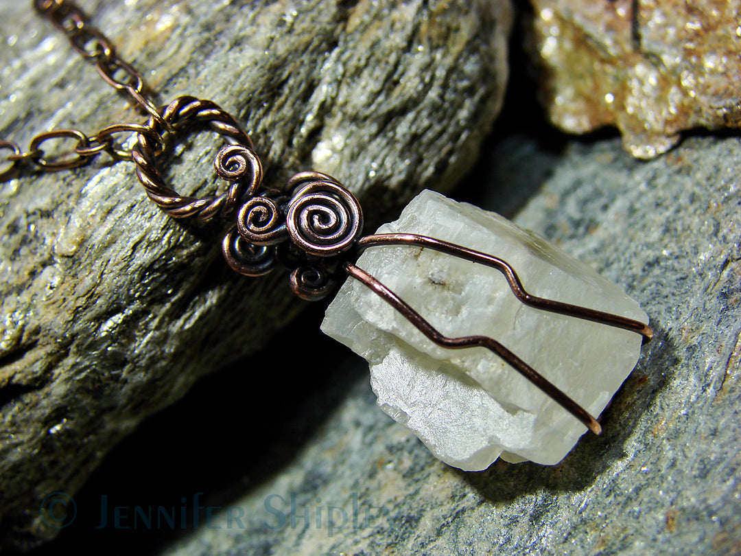 Rough moonstone crystal wrapped in hypoallergenic copper wire
