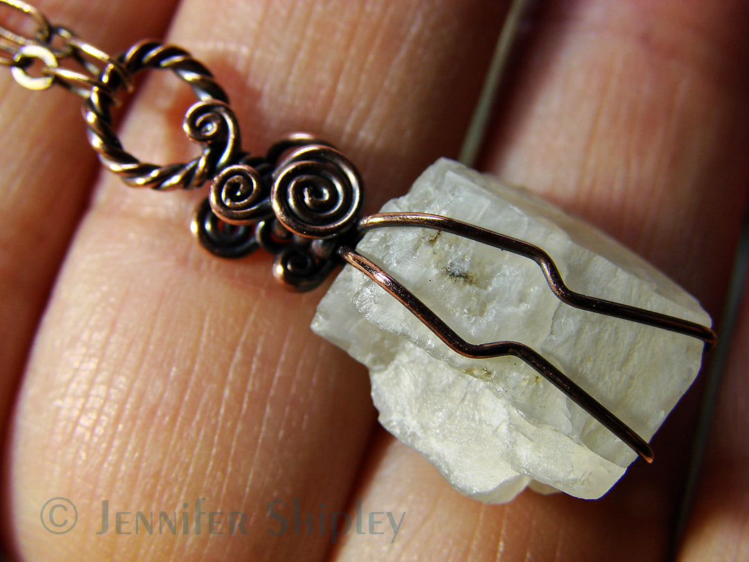 White moonstone crystal pendant with Art Nouveau inspired copper details