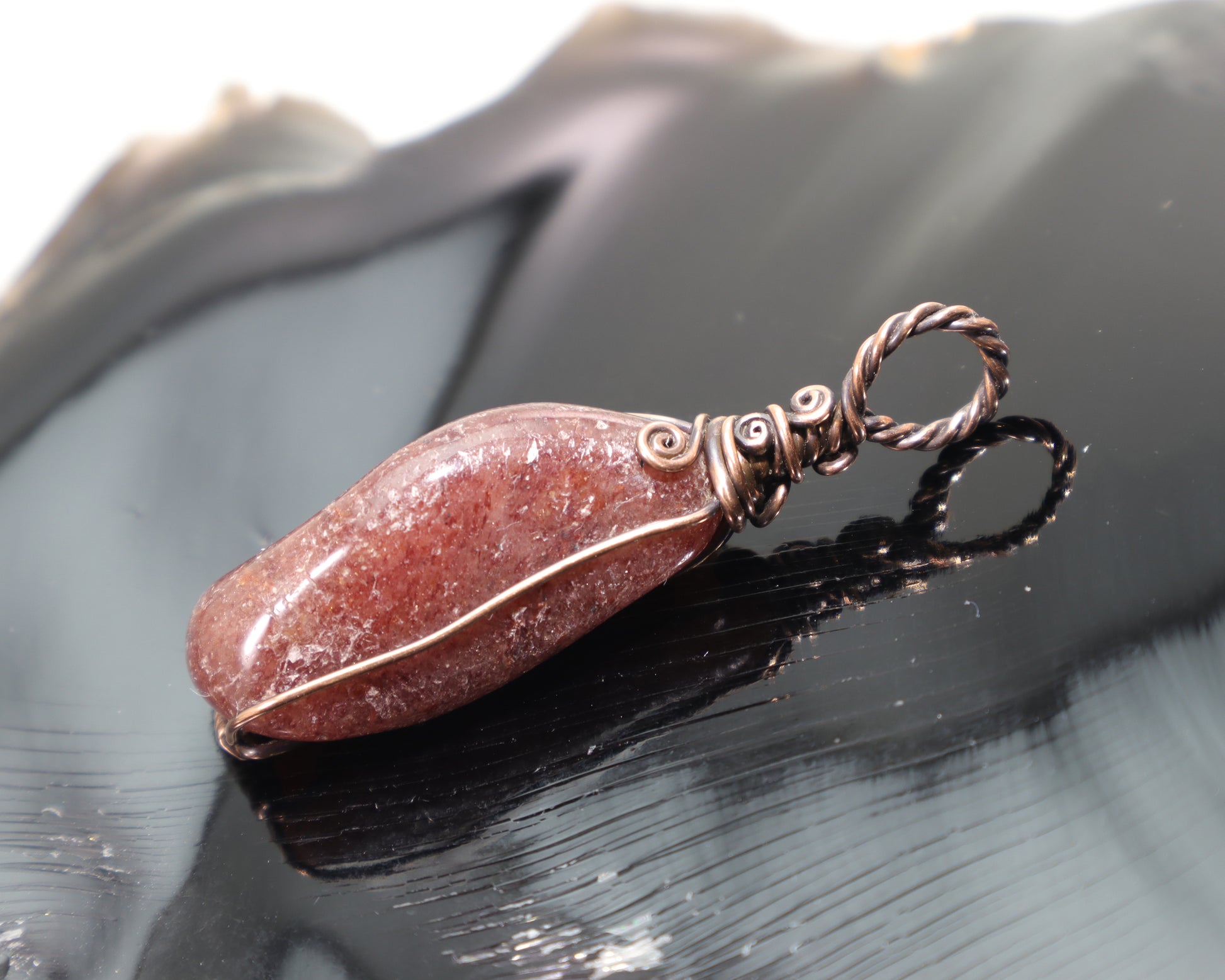 Red aventurine crystal pendant with spiral wire wrapped copper bail